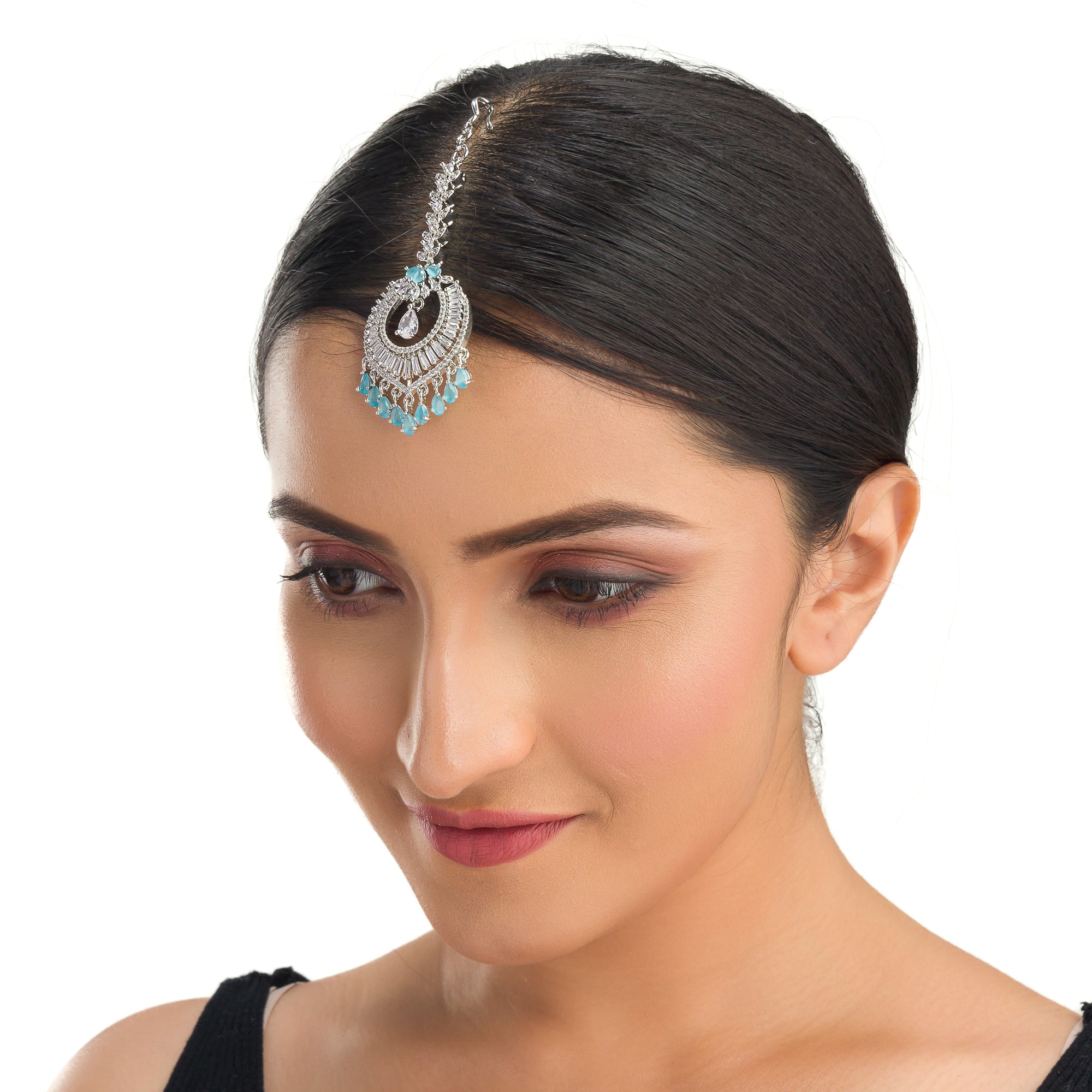 Aqua blue zircon maang tika in silver, perfect for party wear, adding a vibrant and elegant accent