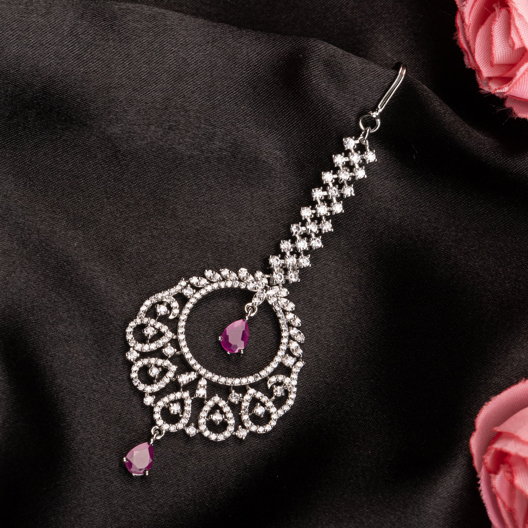 Pink zircon maang tika in silver, perfect for party wear, adding a chic touch of color and elegance