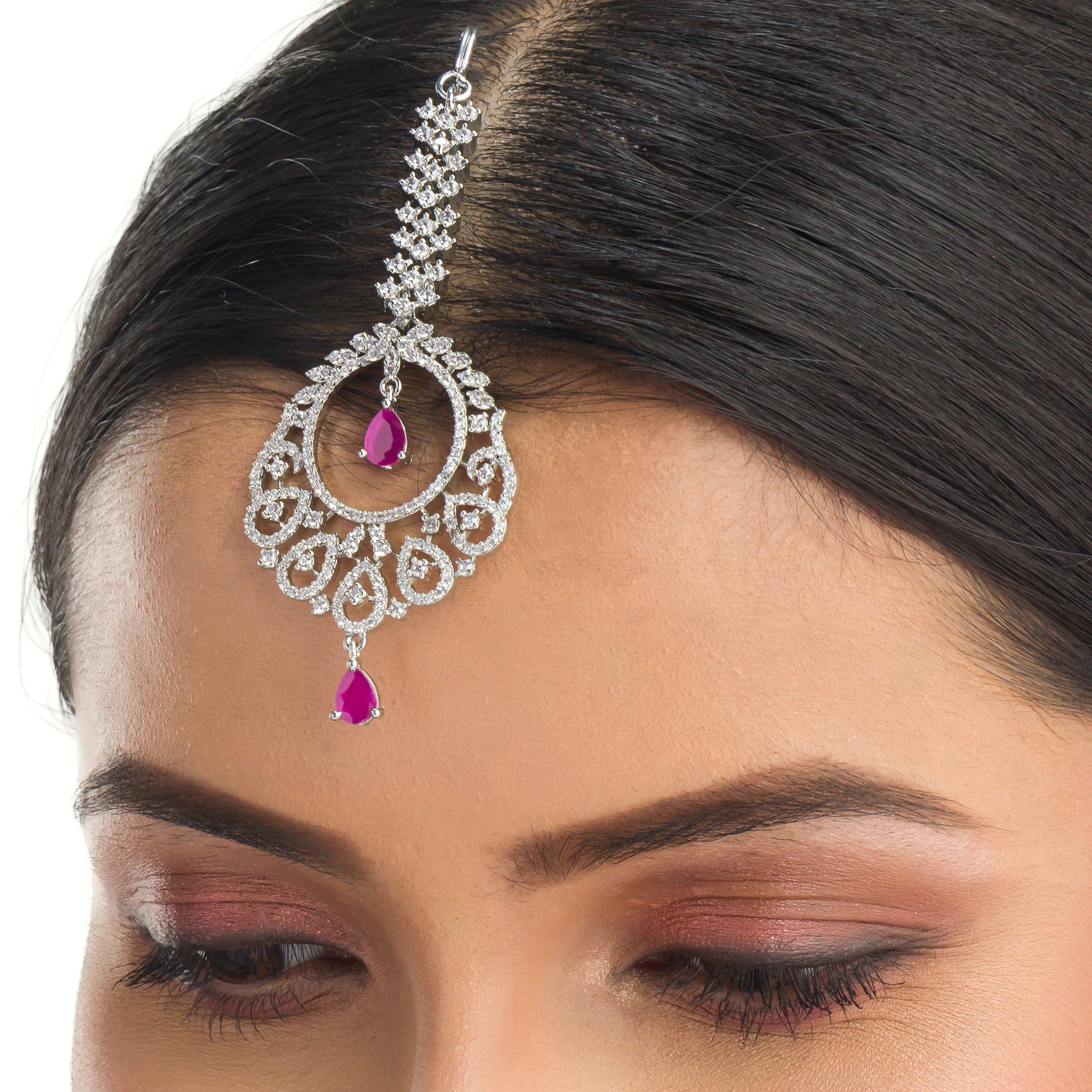 Pink zircon maang tika in silver, perfect for party wear, adding a chic touch of color and elegance