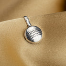 Small oxidized nose pin in silver, perfect for festival wear, adding a delicate vintage touch.