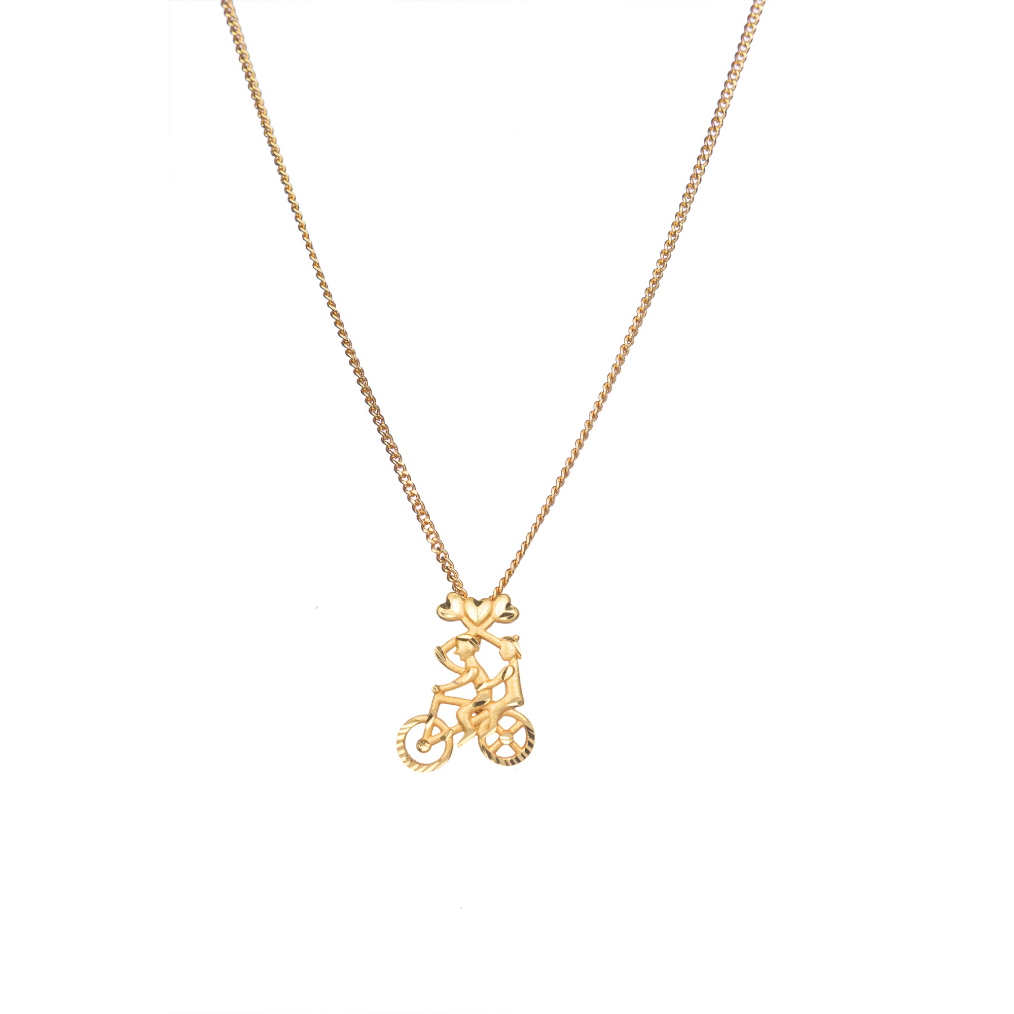 "Gold-tone pendant featuring a boy riding a bicycle, perfect for casual wear, with a fun and unique design."