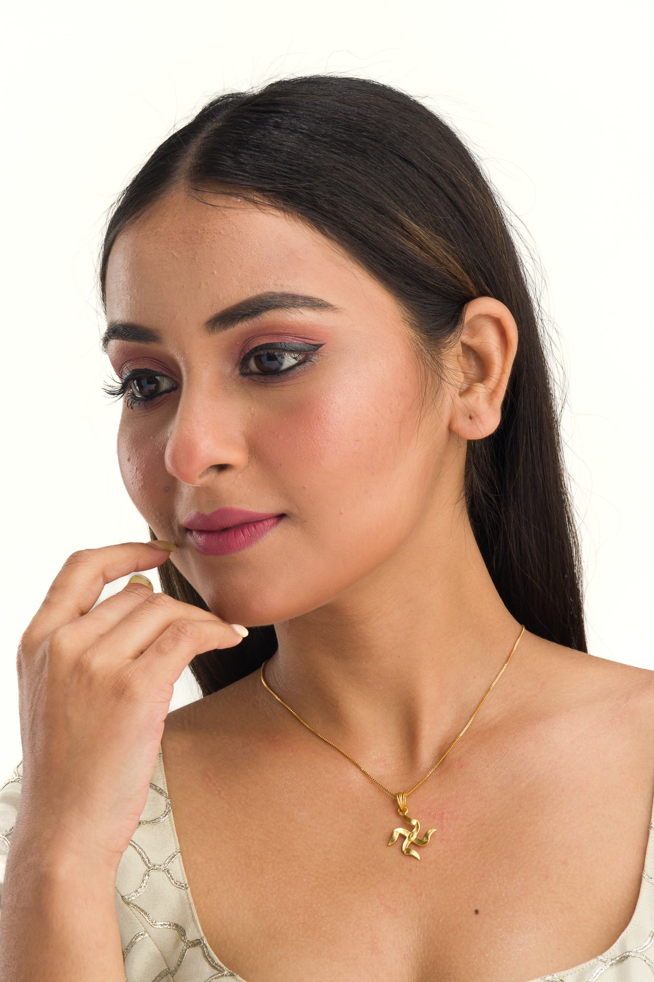 Elegant gold-tone pendant with a Swastik design, perfect for casual wear, adding a meaningful touch."