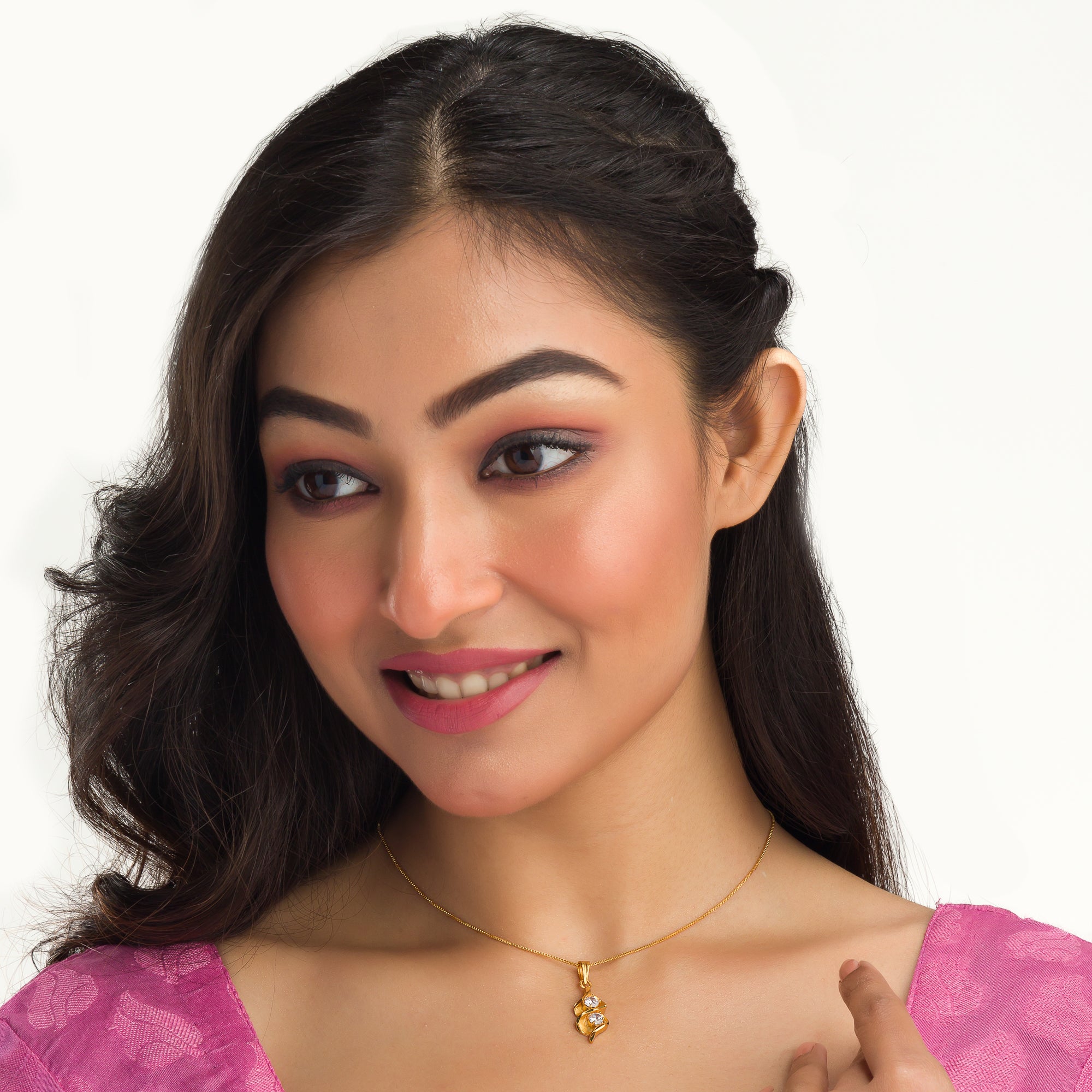 Gold-tone pendant in infinity shape with two stones, perfect for casual wear, adding elegance