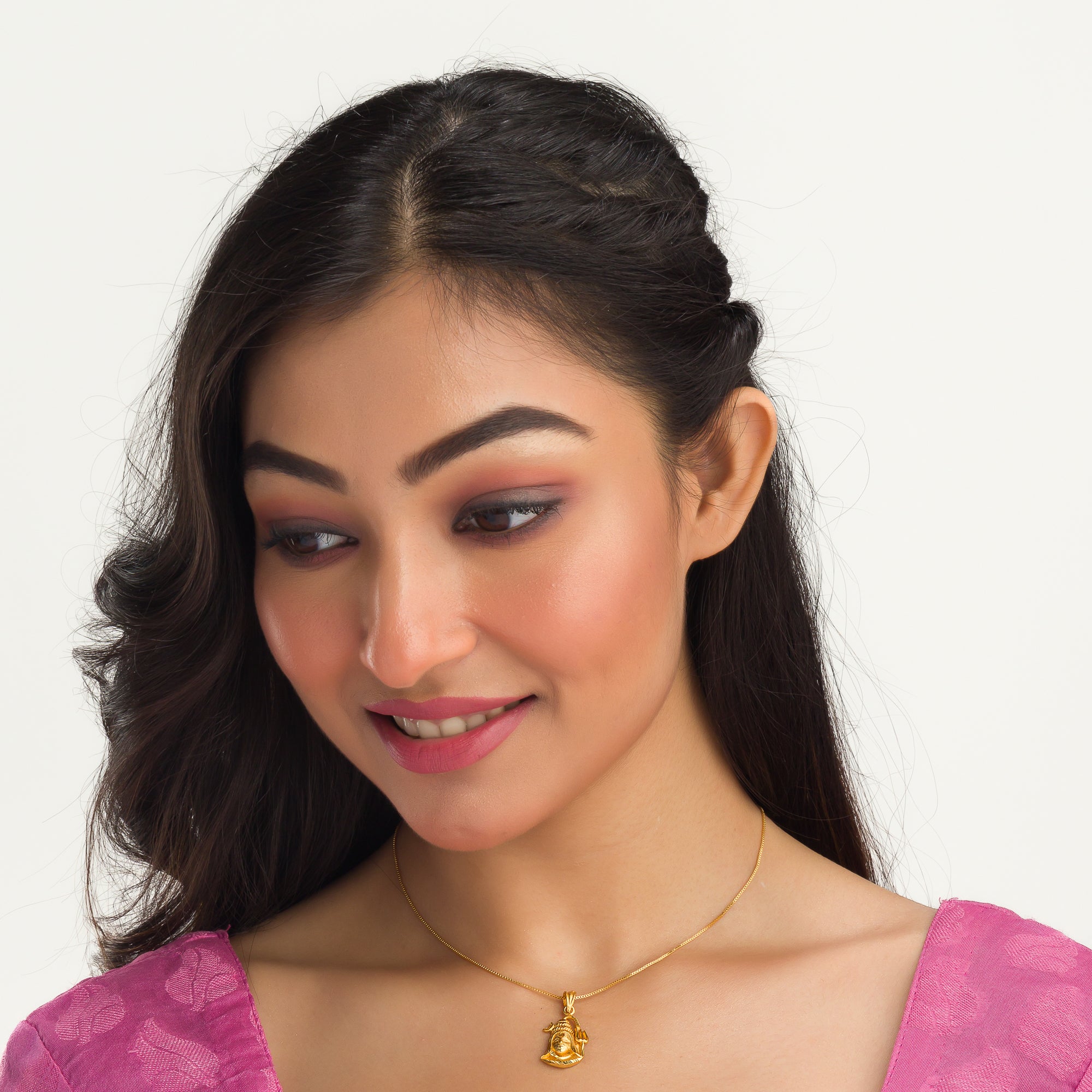 "Gold-tone pendant set featuring Shivji with half moon and trishul, perfect for casual wear."