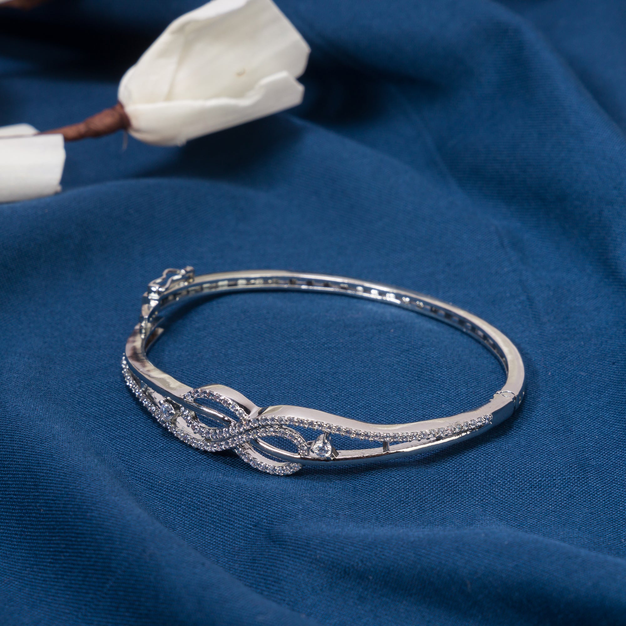 "Elegant zircon infinity bracelet, perfect for party wear, offering a timeless and chic style."