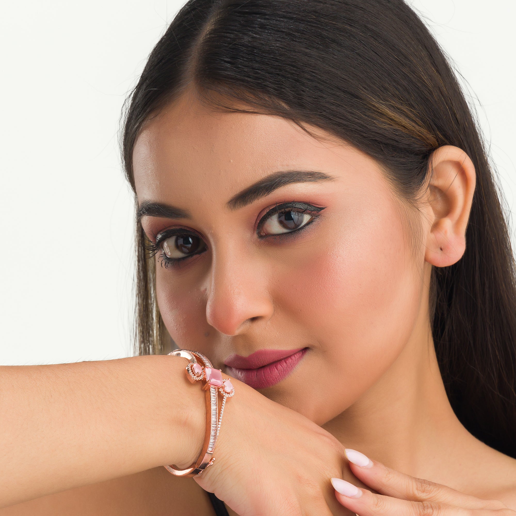 Stunning pink zircon bracelet in rosegold, perfect for party wear, offering a vibrant, chic look."