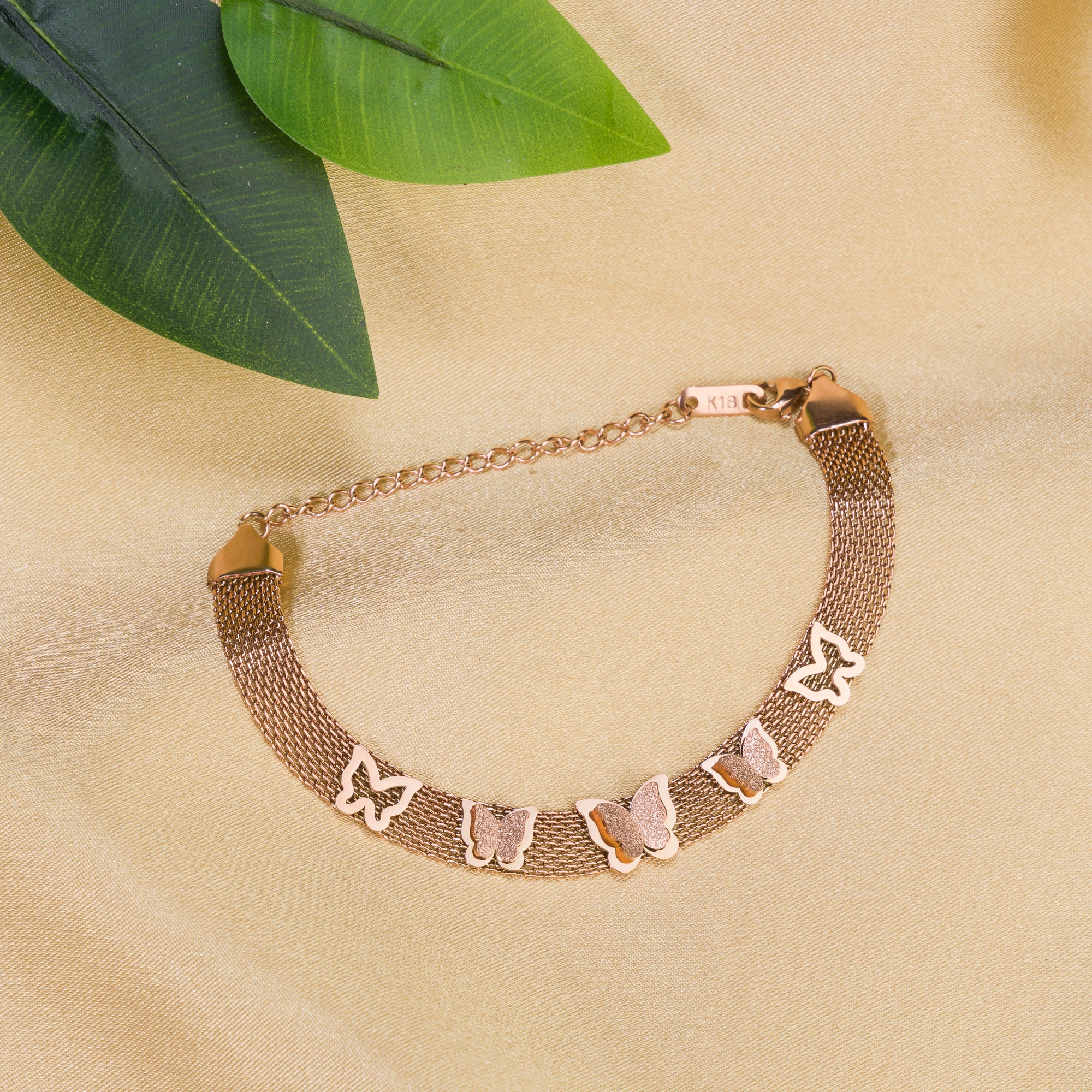 "Rosegold stainless steel bracelet with butterfly details, perfect for casual wear, adding a delicate touch."