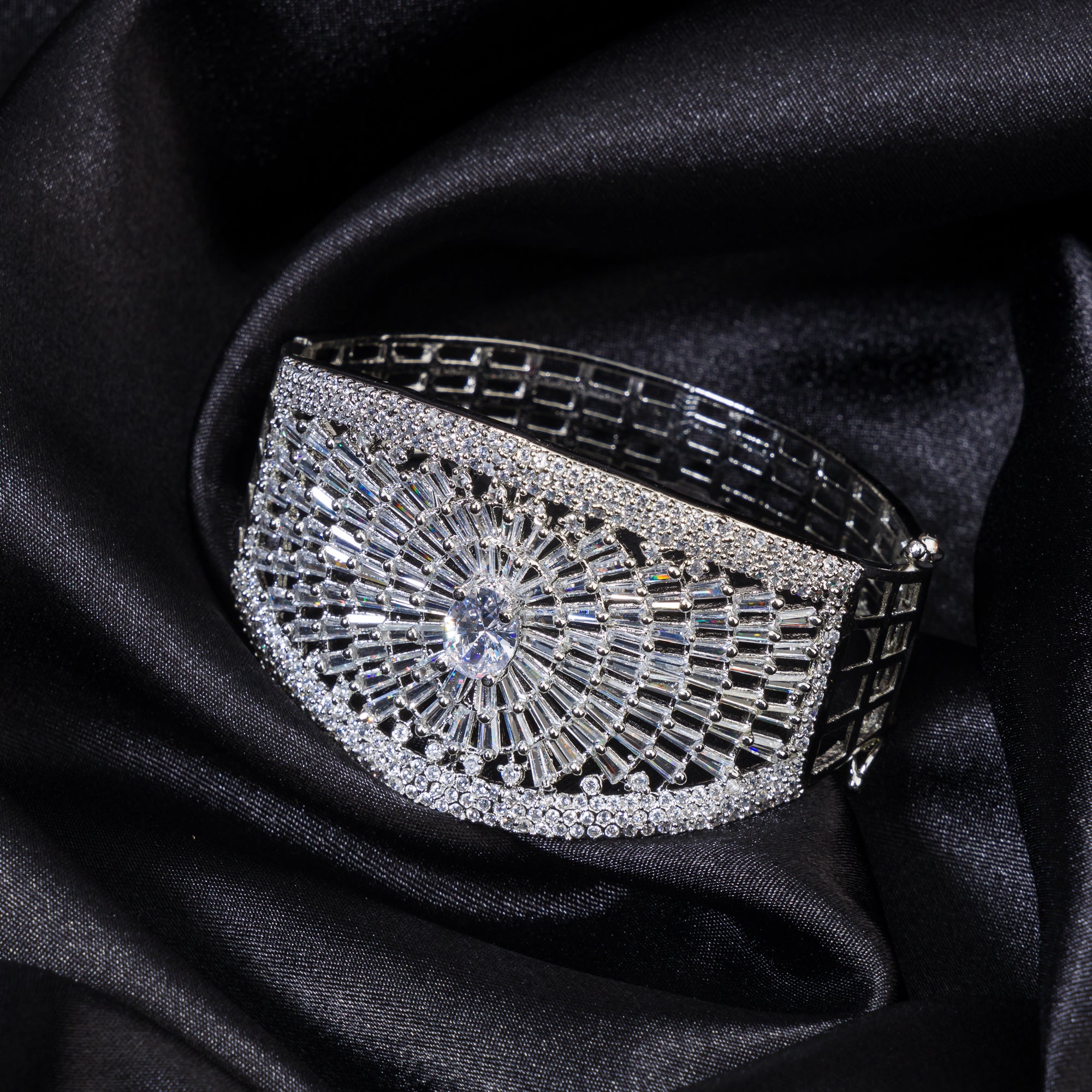 "Elegant zircon bracelet with a single stone surrounded by zircon accents, perfect for party wear."