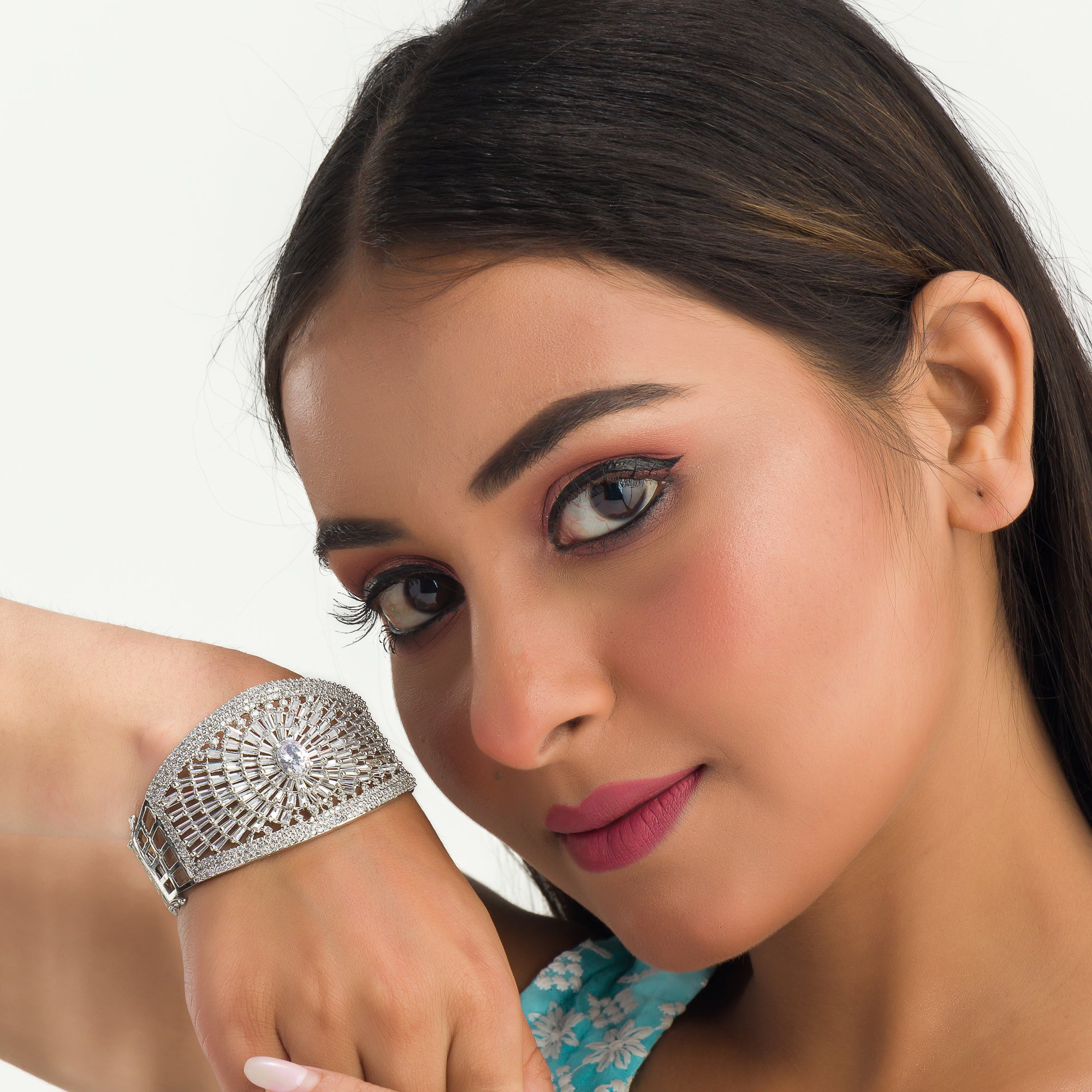 "Elegant zircon bracelet with a single stone surrounded by zircon accents, perfect for party wear."