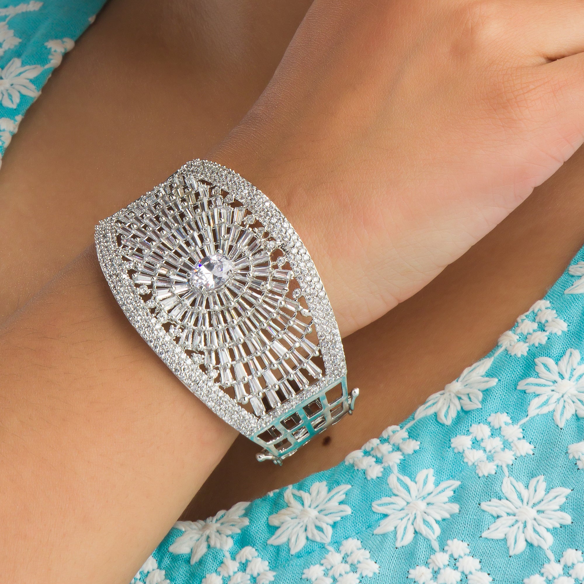 "Elegant zircon bracelet with a single stone surrounded by zircon accents, perfect for party wear."