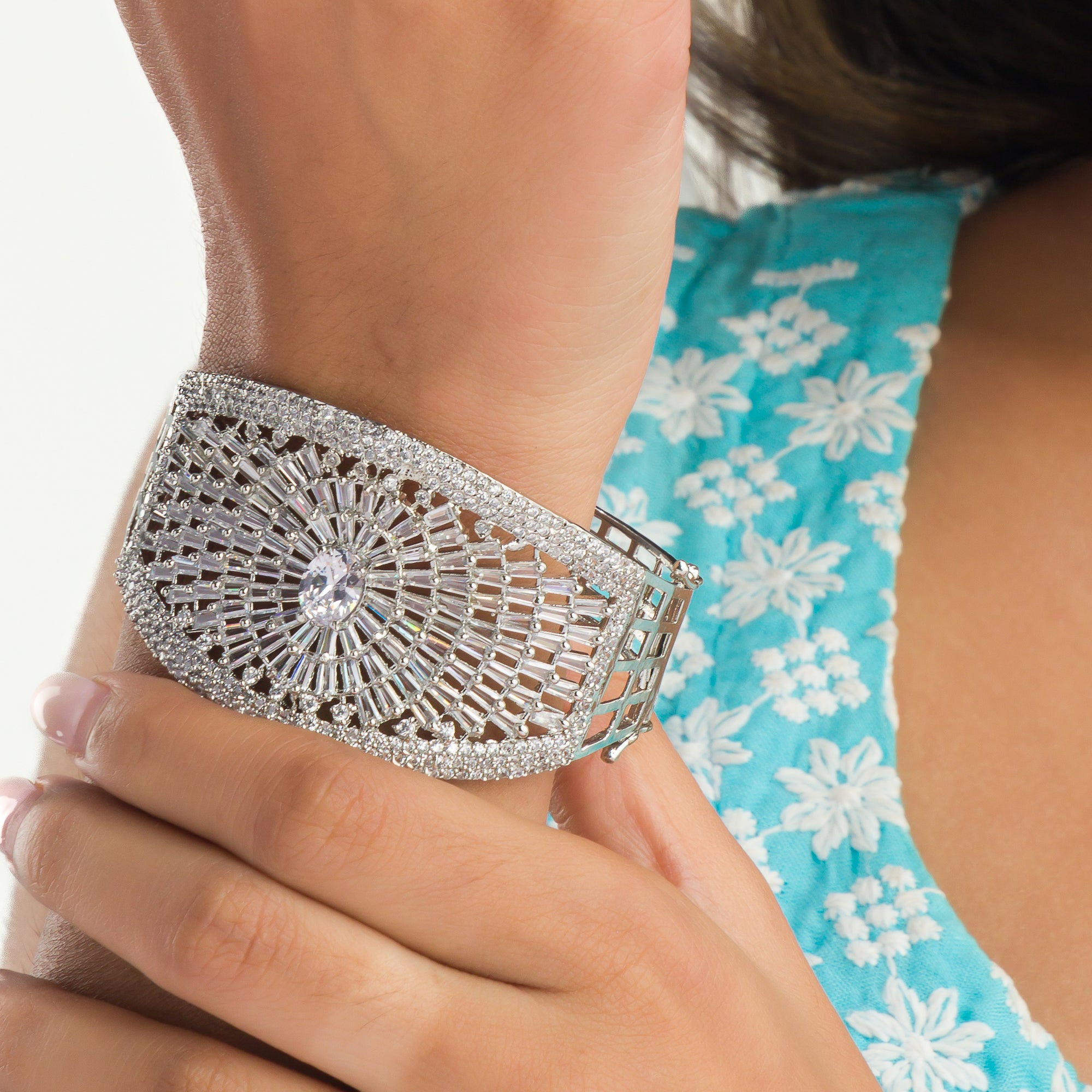 "Elegant zircon bracelet with a single stone surrounded by zircon accents, perfect for party wear."