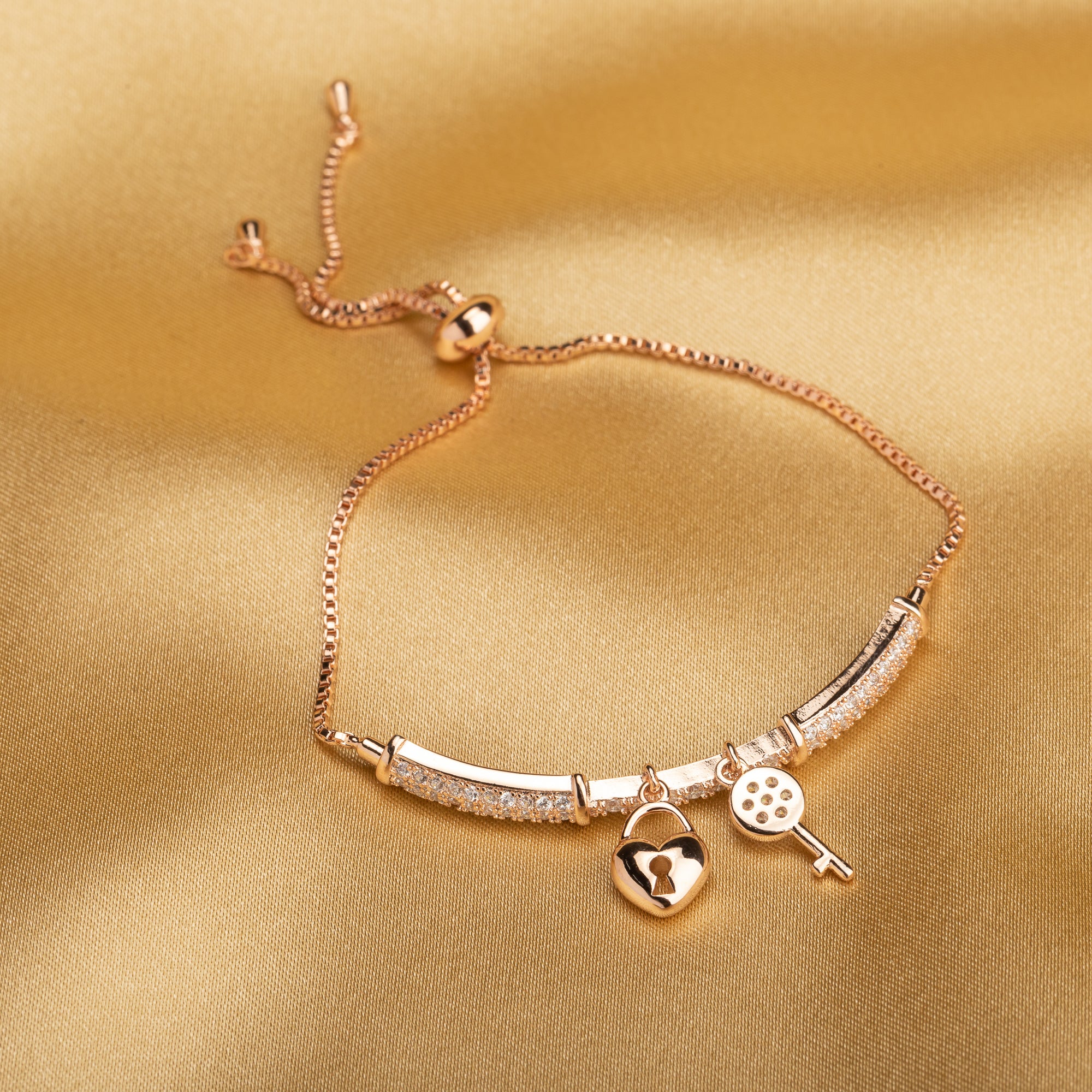"Trendy lock and key zircon bracelet in rosegold, ideal for party wear, offering a chic and stylish look."