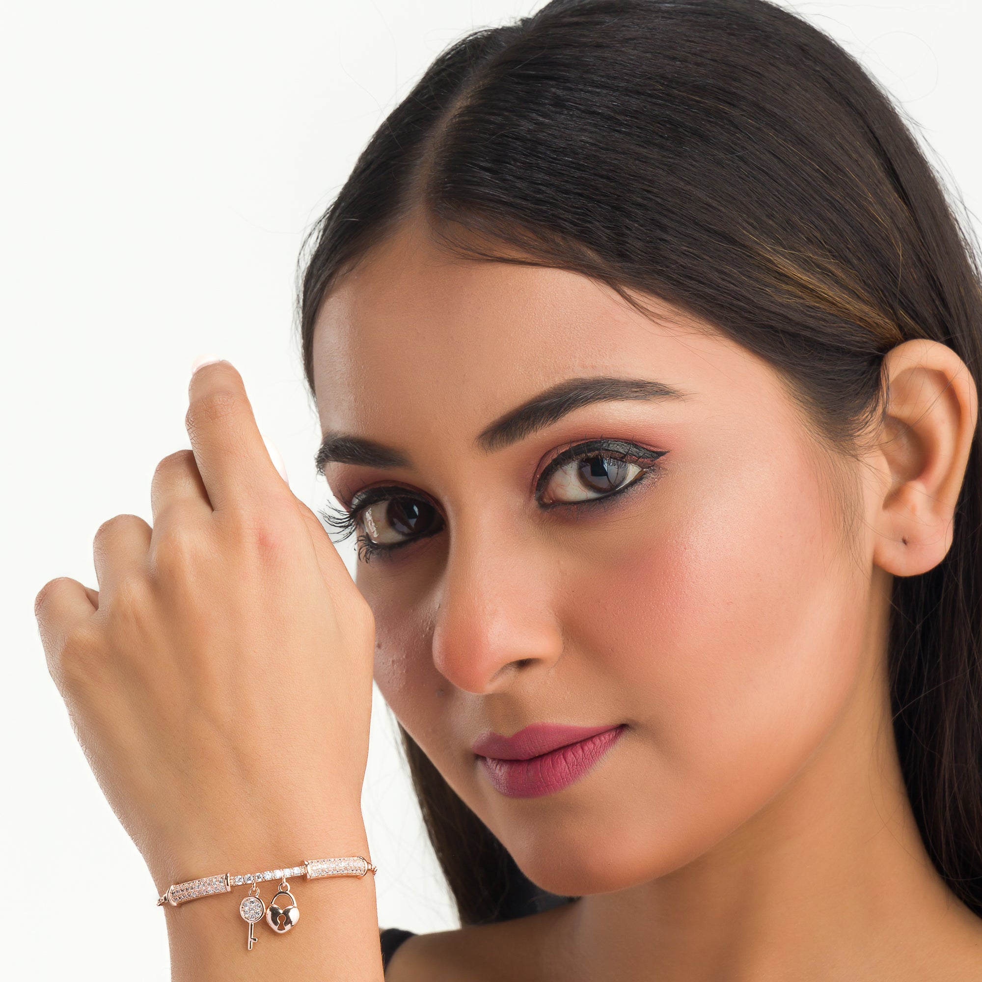 "Trendy lock and key zircon bracelet in rosegold, ideal for party wear, offering a chic and stylish look."