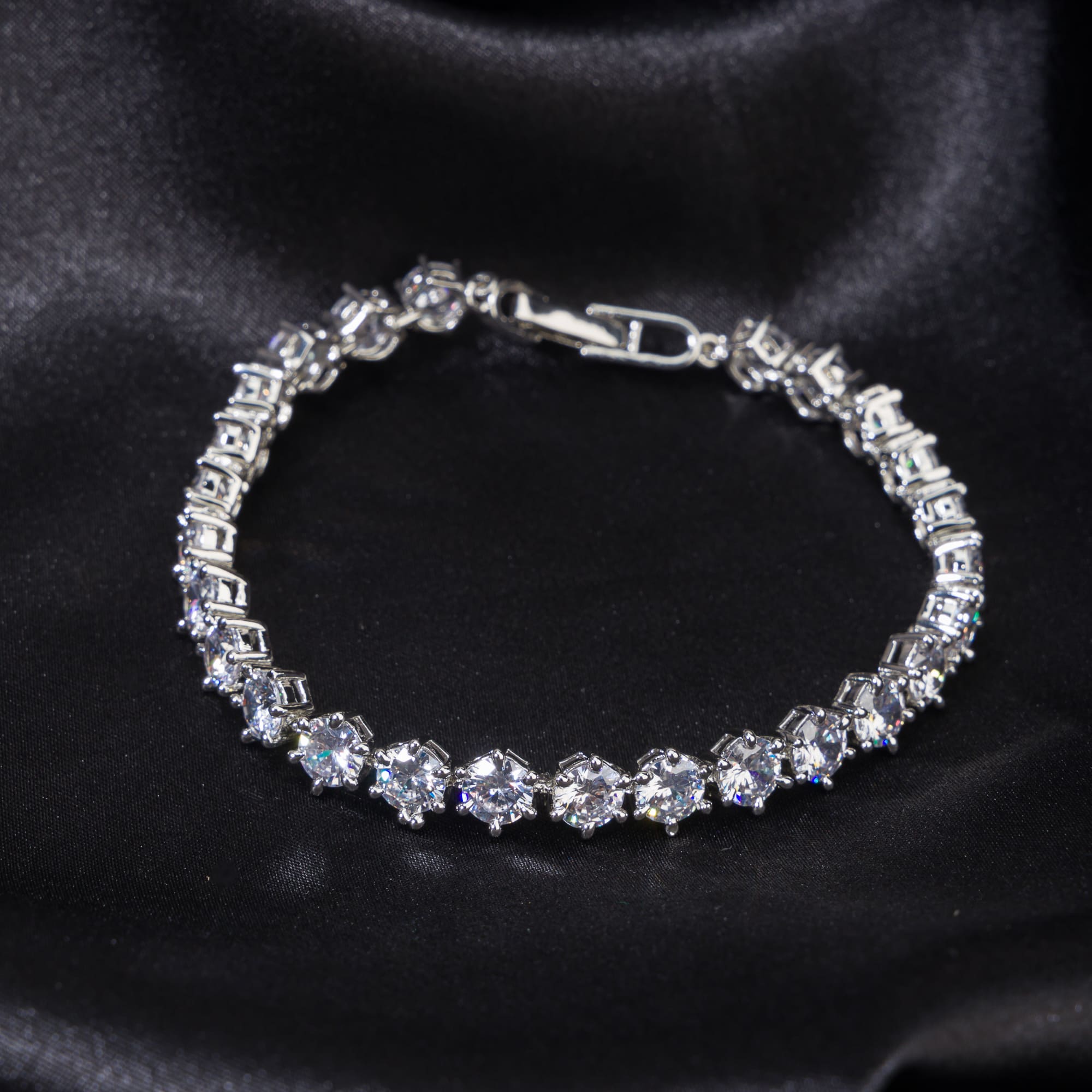Stunning zircon stone chain bracelet in silver, perfect for party wear, adding sparkle and elegance."