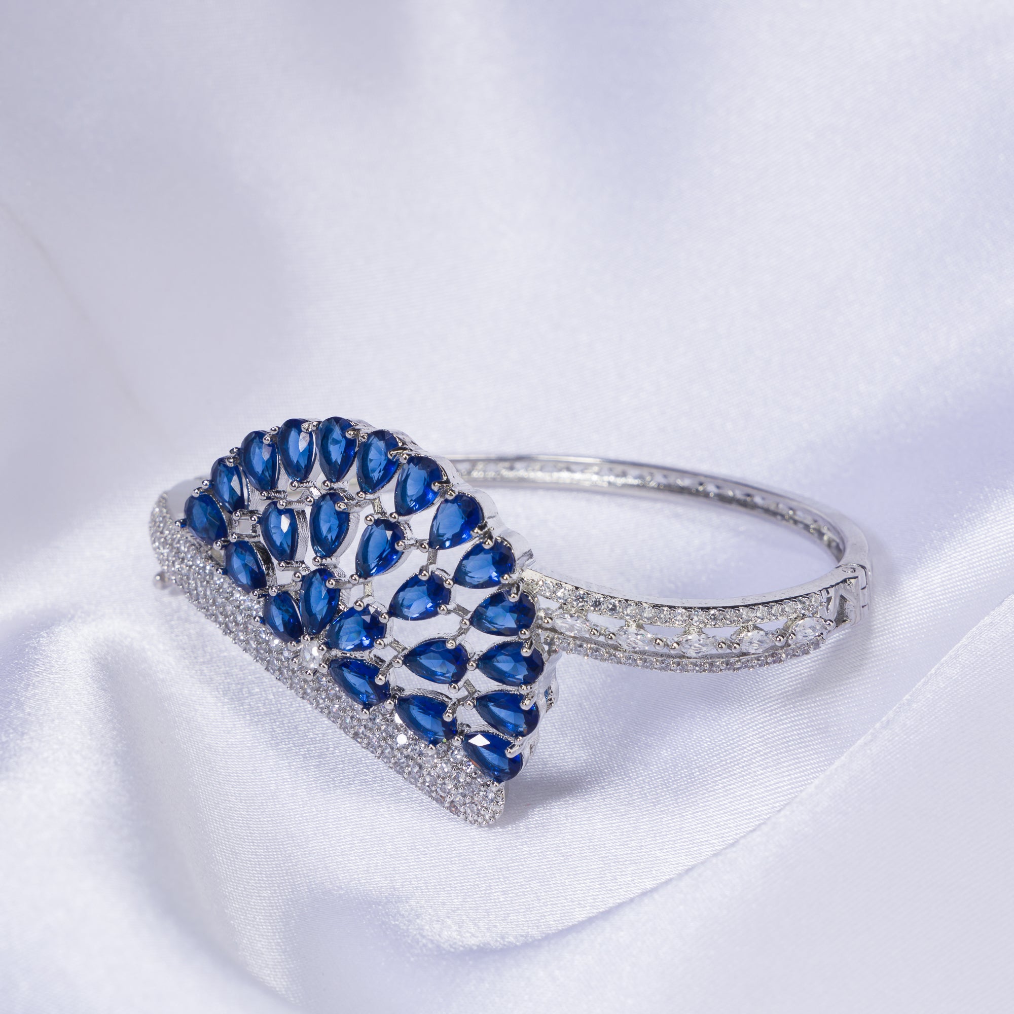"Blue zircon bracelet in silver, radiating with captivating azure brilliance, perfect for party wear."