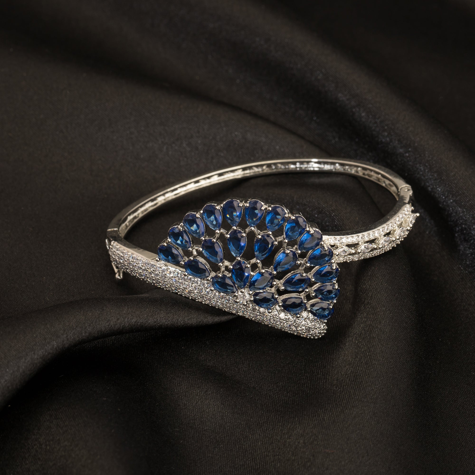 "Blue zircon bracelet in silver, radiating with captivating azure brilliance, perfect for party wear."