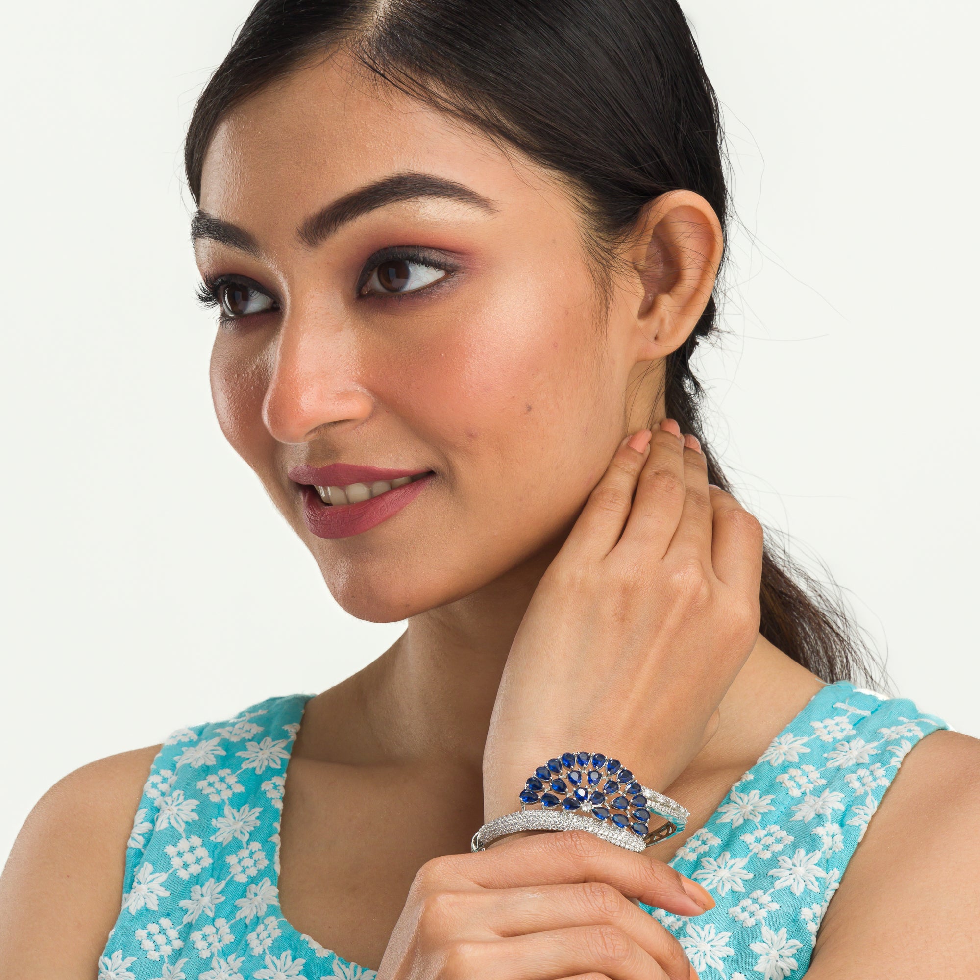 "Blue zircon bracelet in silver, radiating with captivating azure brilliance, perfect for party wear."