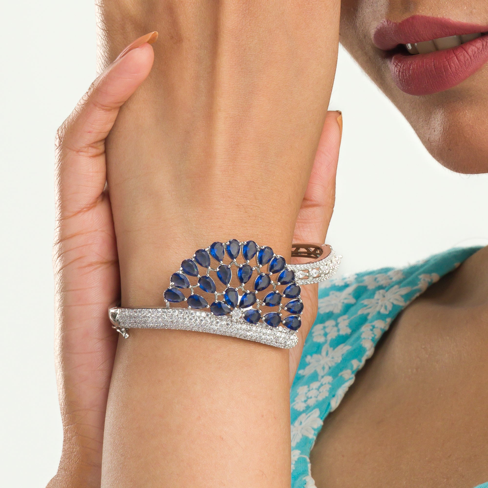 "Blue zircon bracelet in silver, radiating with captivating azure brilliance, perfect for party wear."