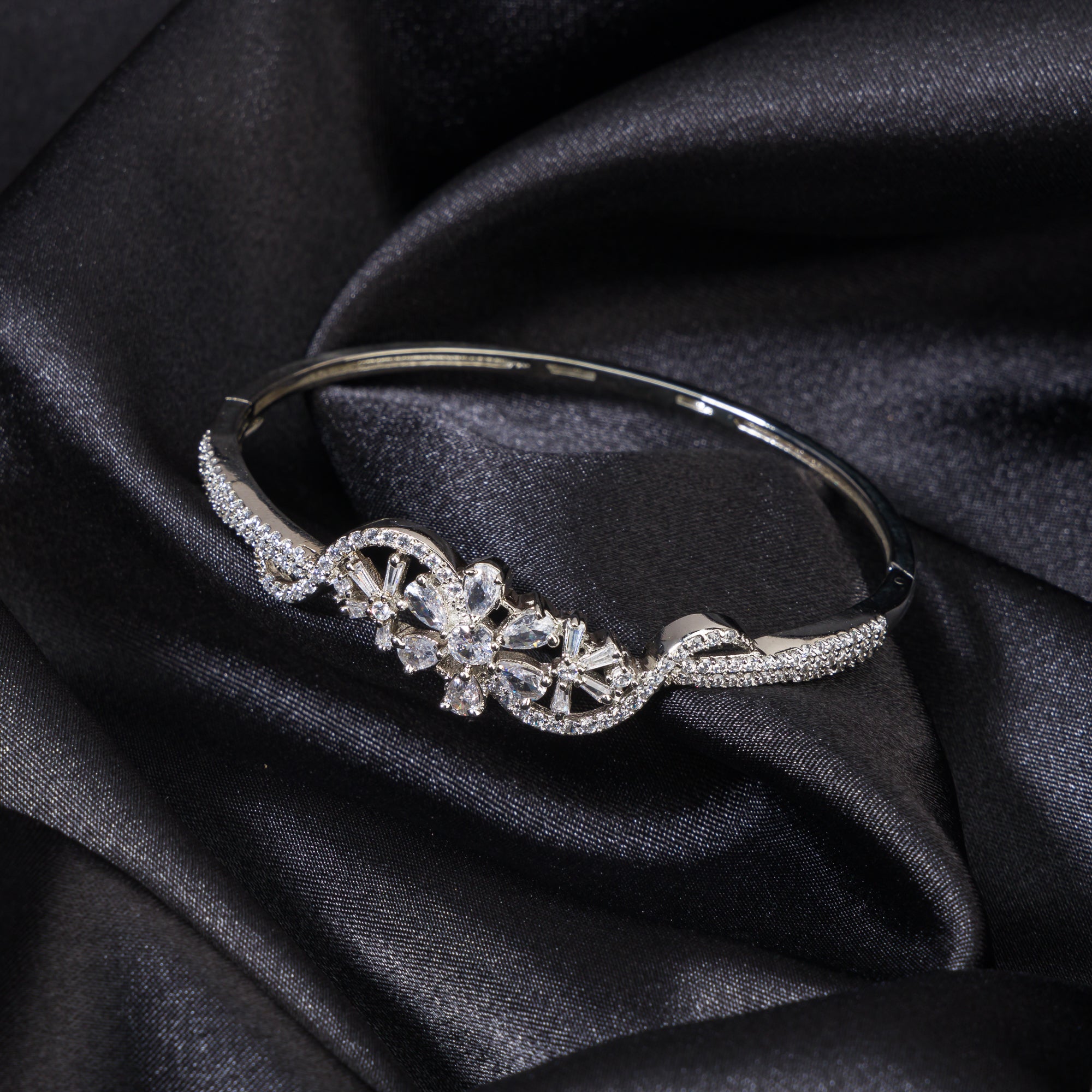 "Brilliant zircon bracelet in silver, showcasing dazzling clarity and gem-like radiance, ideal for party wear."