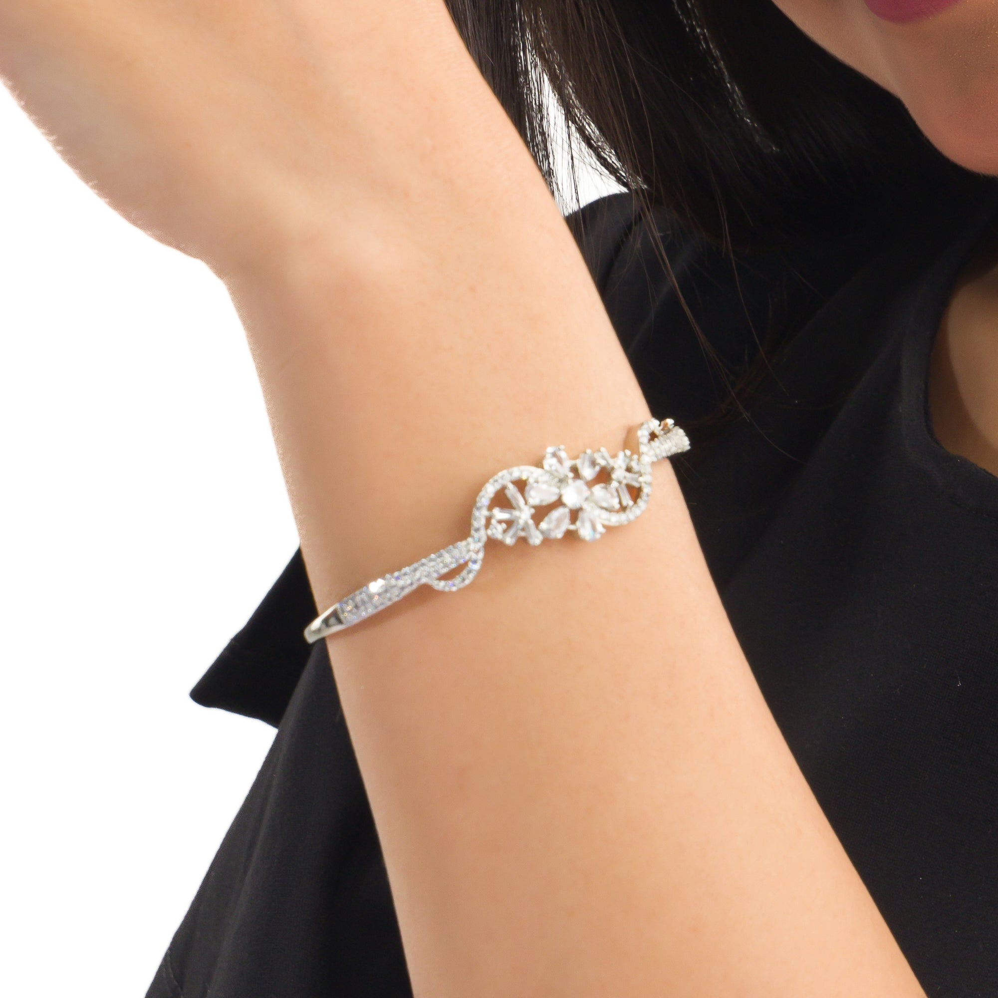 "Brilliant zircon bracelet in silver, showcasing dazzling clarity and gem-like radiance, ideal for party wear."