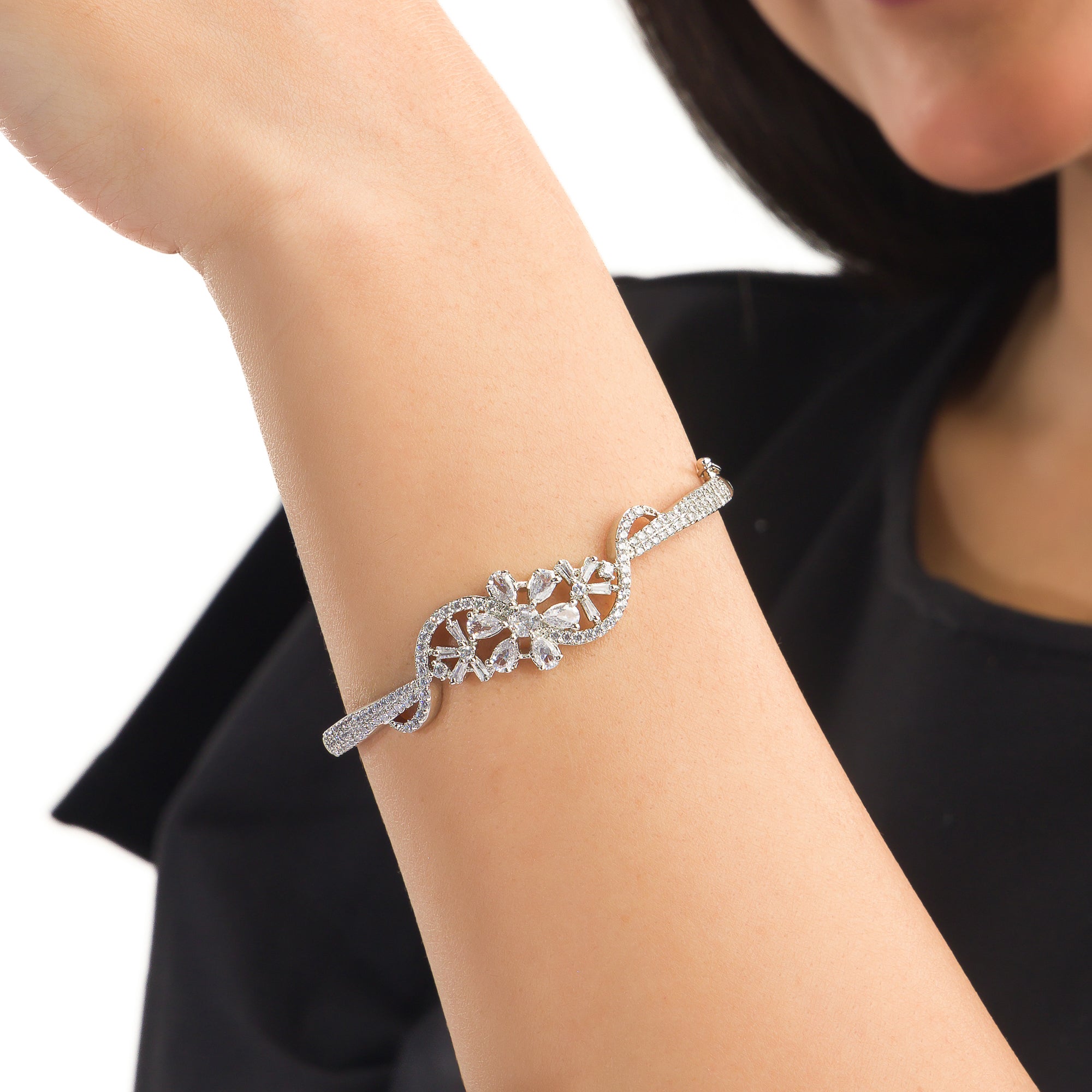 "Brilliant zircon bracelet in silver, showcasing dazzling clarity and gem-like radiance, ideal for party wear."