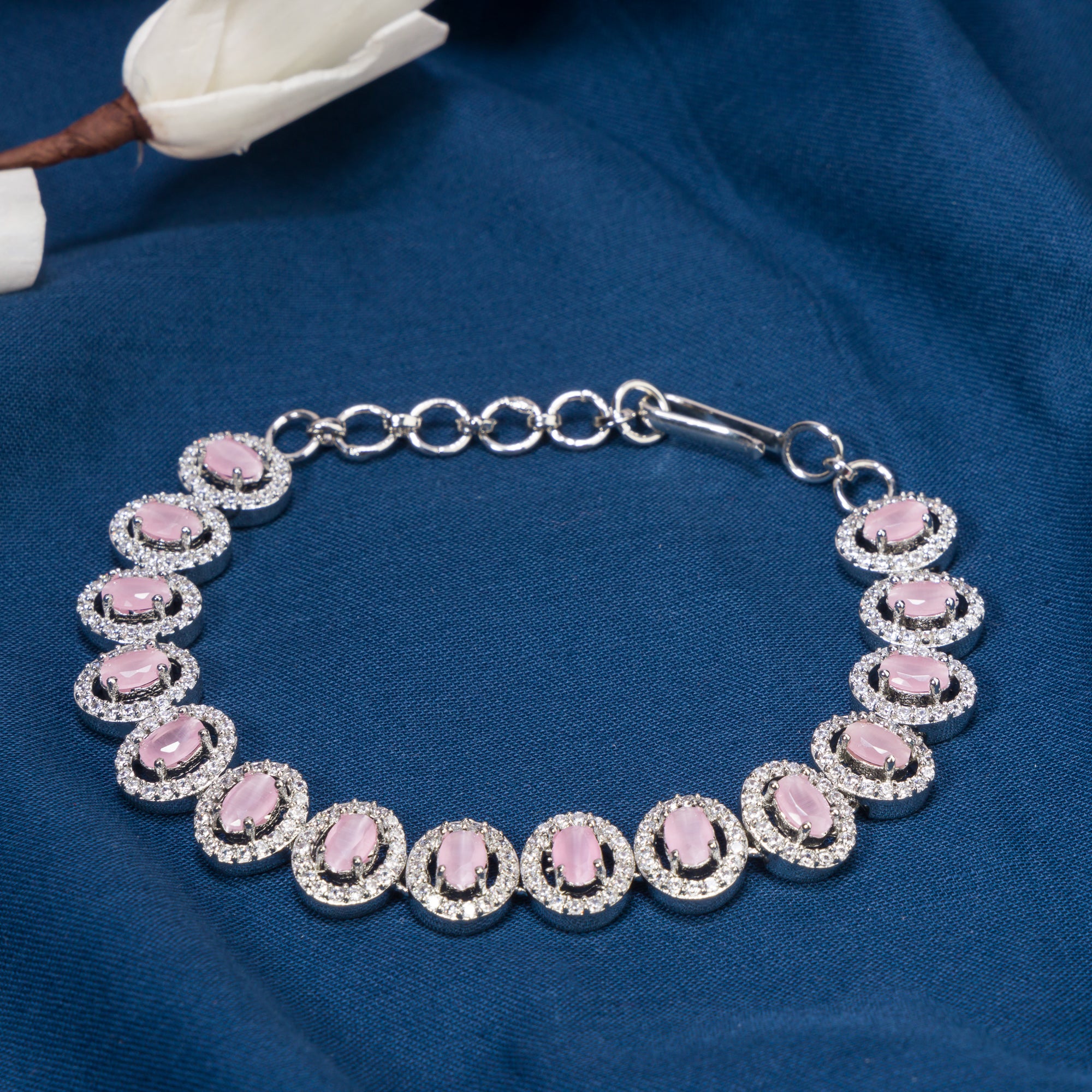 "Delicate pink zircon bracelet in silver, exuding vibrant charm with its soft, rosy glow for party wear."