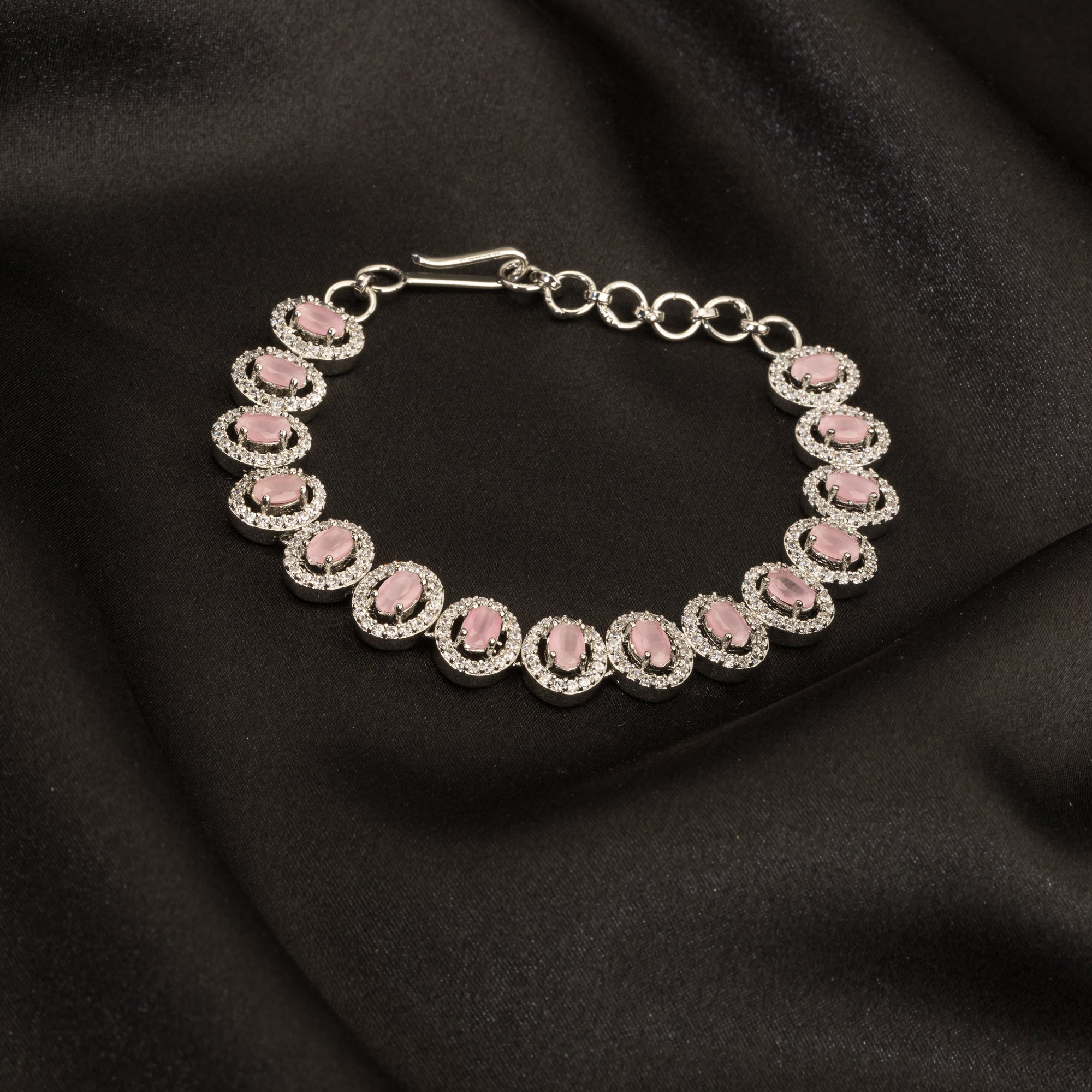 "Delicate pink zircon bracelet in silver, exuding vibrant charm with its soft, rosy glow for party wear."