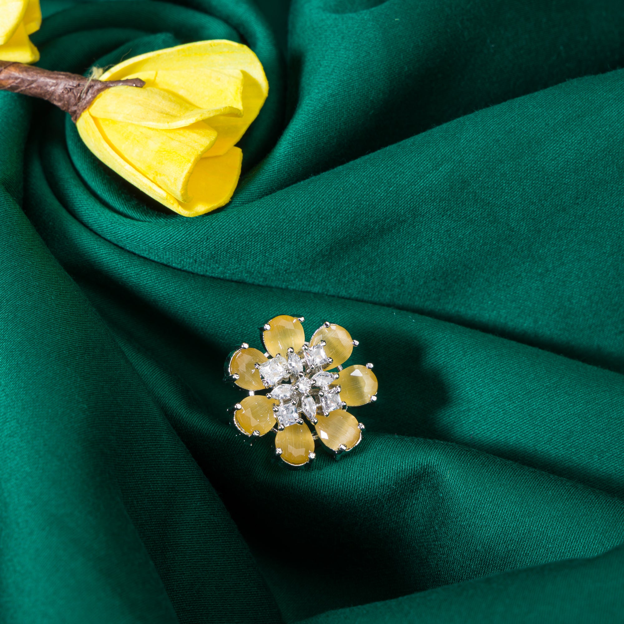 "Yellow zircon finger ring in silver, offering vibrant, sunny brilliance and golden charm for party wear."