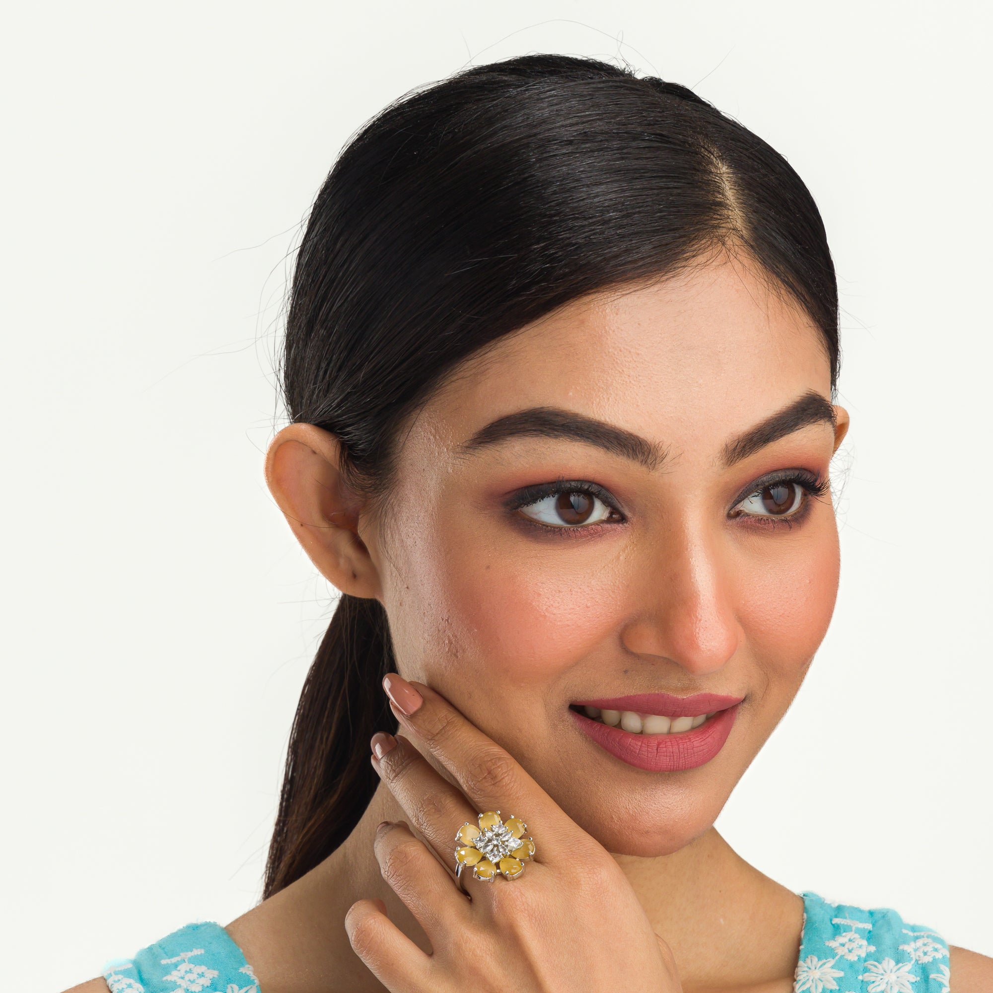 "Yellow zircon finger ring in silver, offering vibrant, sunny brilliance and golden charm for party wear."