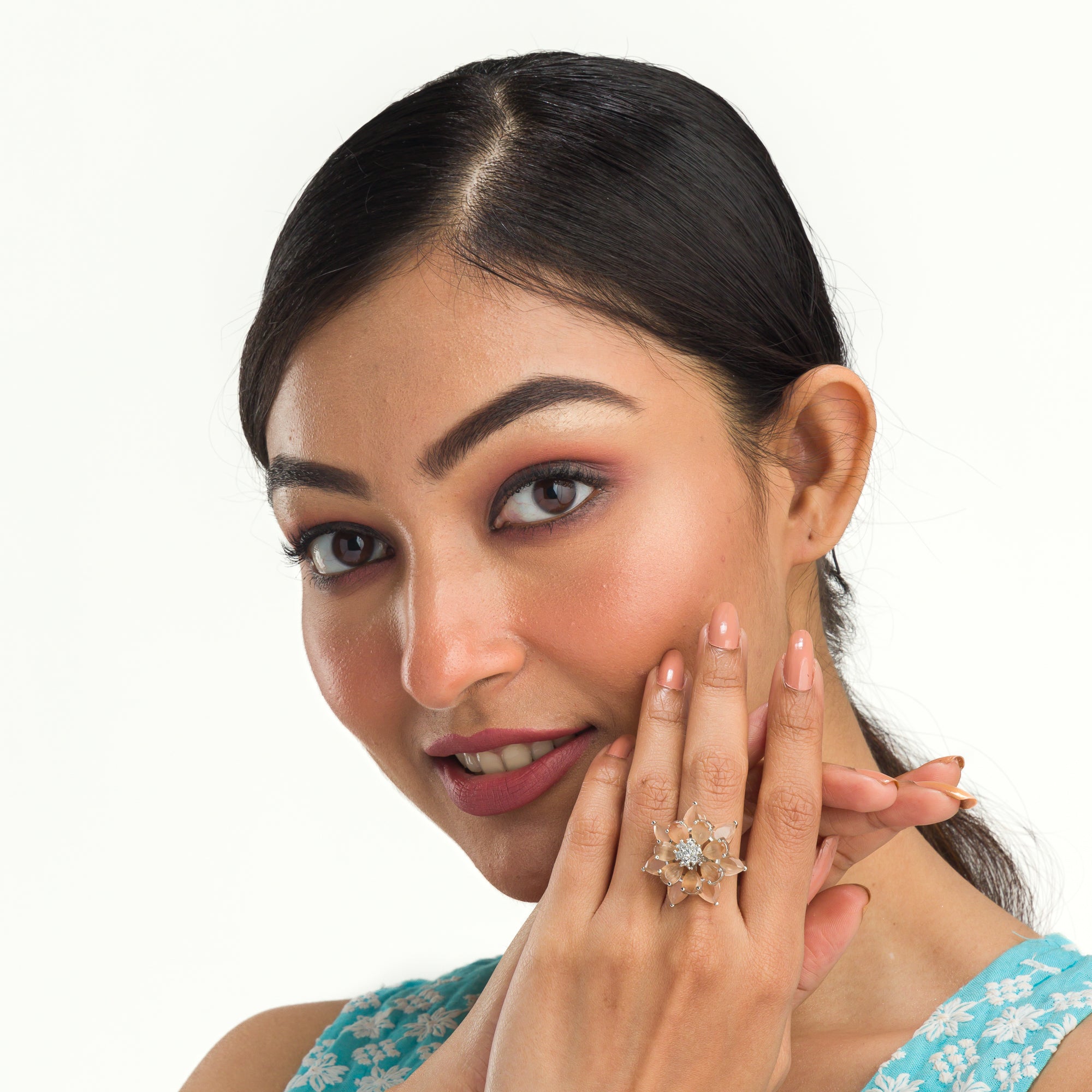 "Salmon zircon finger ring in silver offers a warm, radiant glow with a unique, rosy hue for party wear."