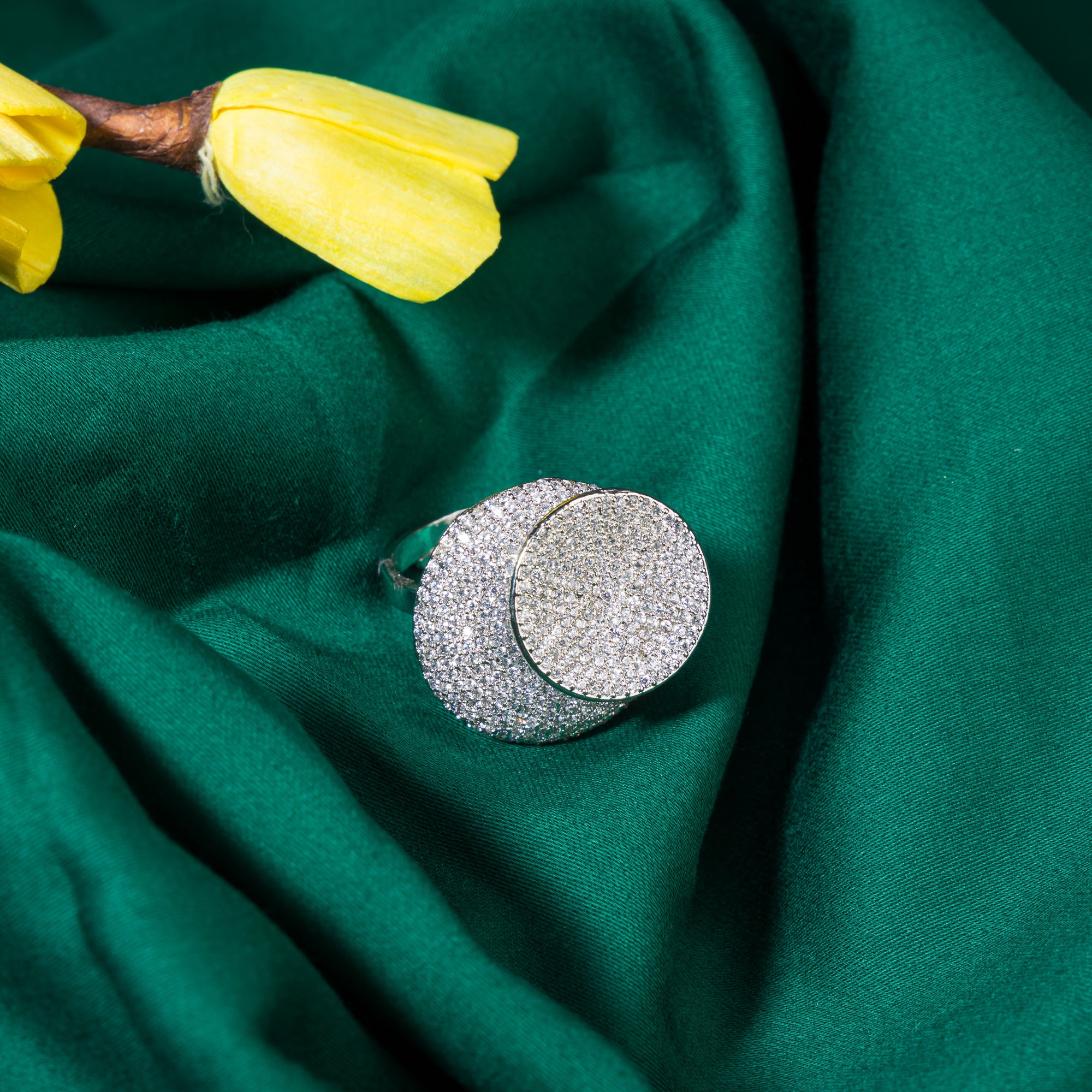 Stunning zircon ring in silver dazzles with vibrant, diamond-like sparkle for a chic party wear look."