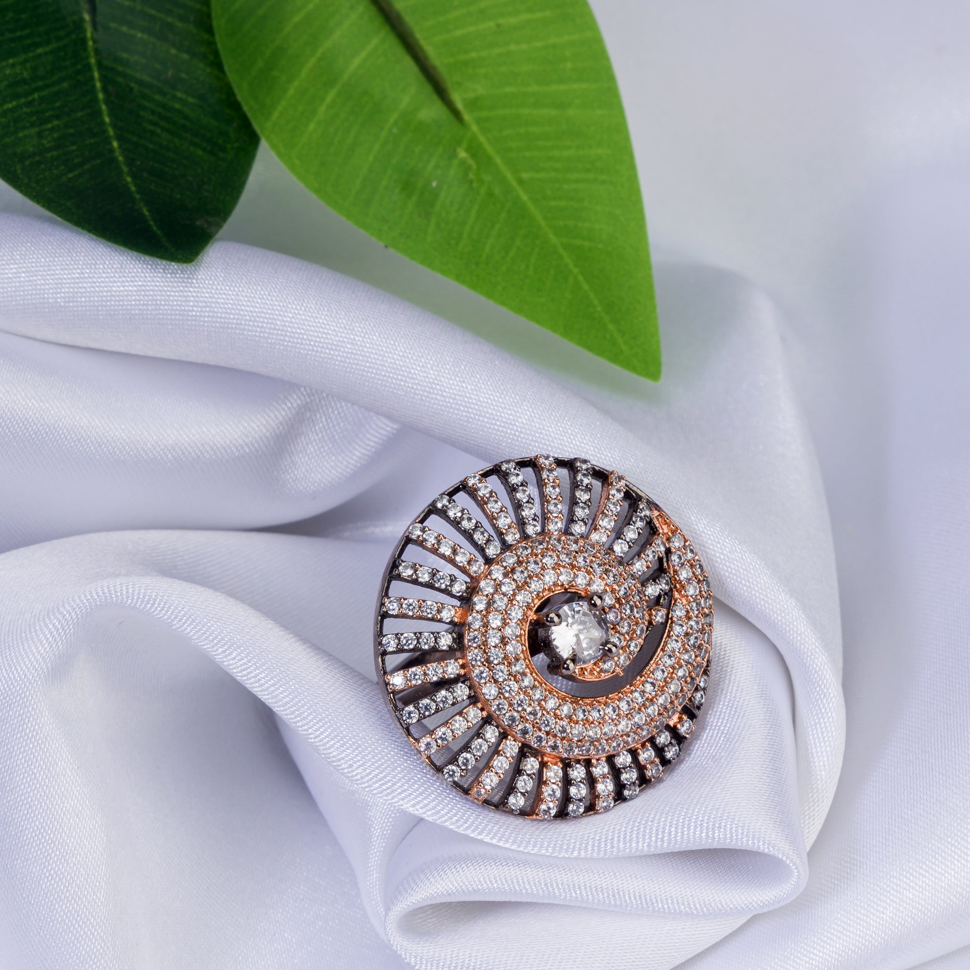 "Rose gold zircon ring with black accents blends elegance and dramatic flair for party wear."