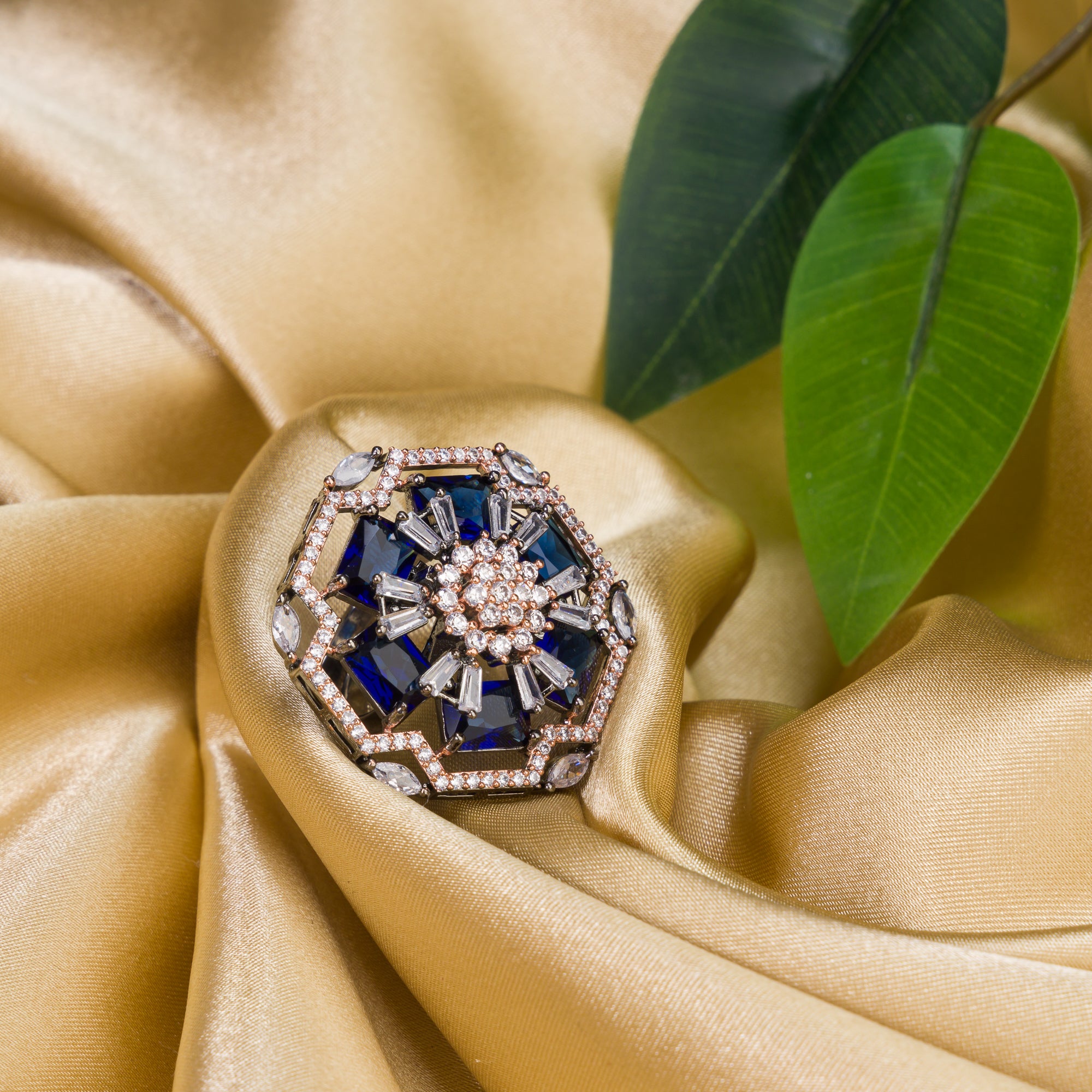 "Rose gold dark blue zircon ring combines luxurious hues with deep sapphire allure for party wear."