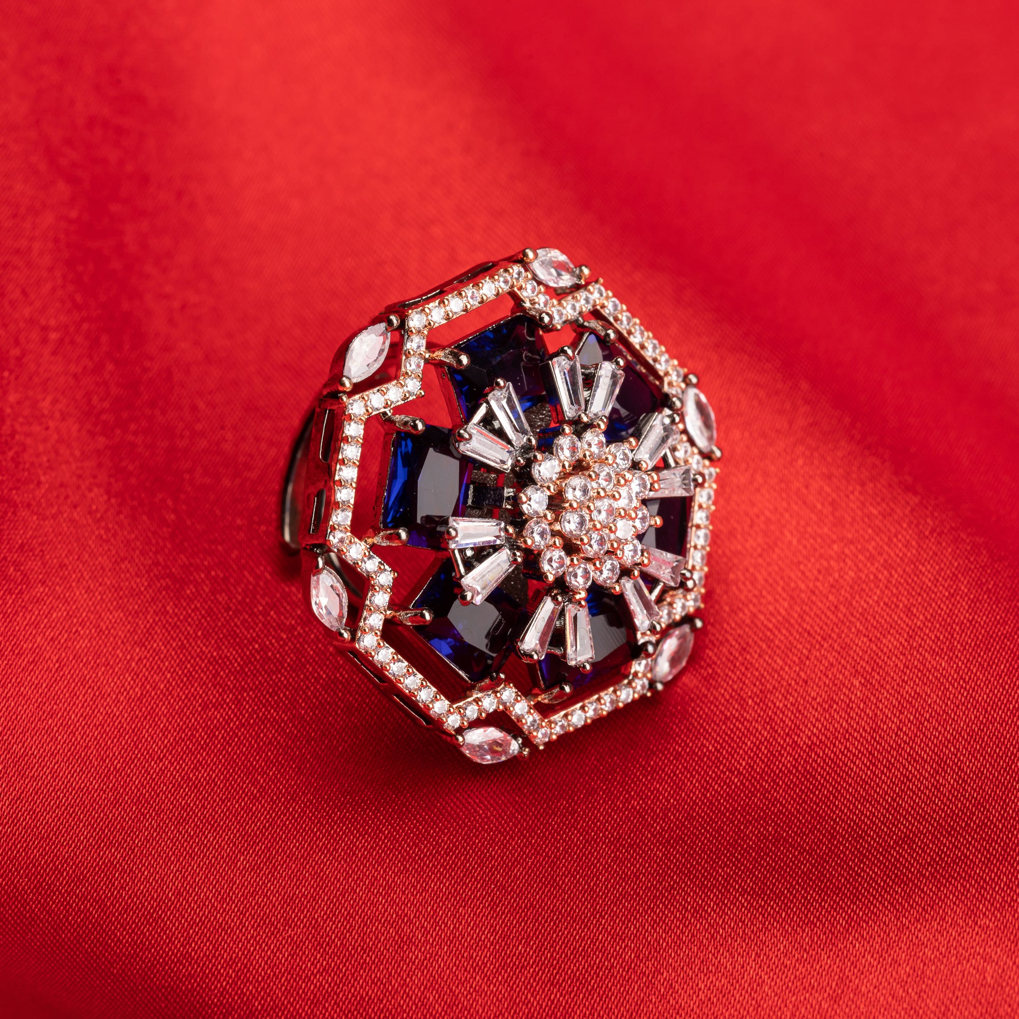 "Rose gold dark blue zircon ring combines luxurious hues with deep sapphire allure for party wear."