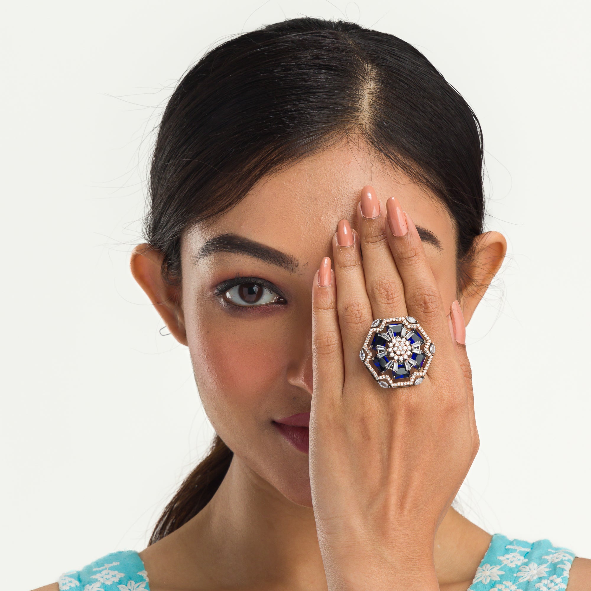 "Rose gold dark blue zircon ring combines luxurious hues with deep sapphire allure for party wear."