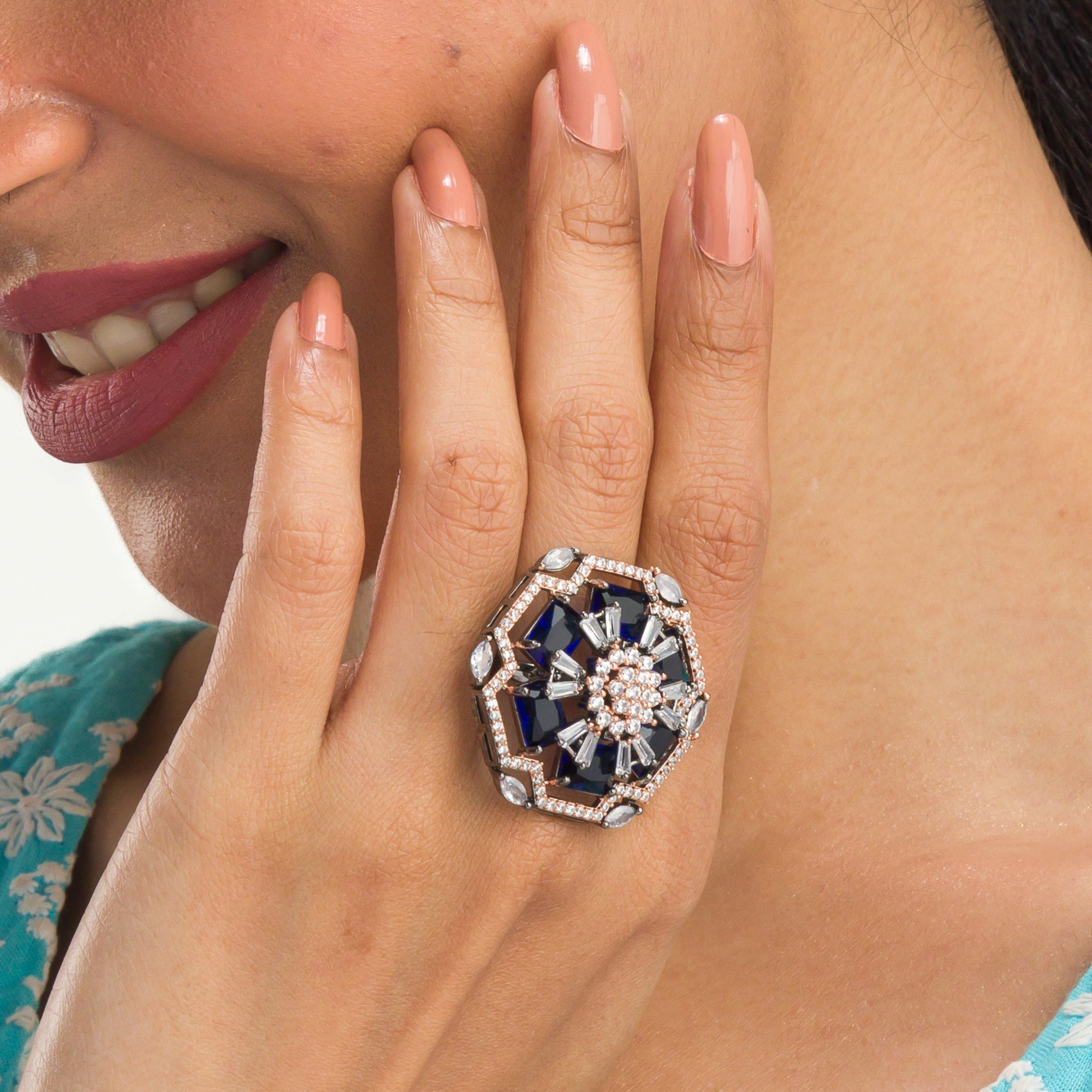 "Rose gold dark blue zircon ring combines luxurious hues with deep sapphire allure for party wear."