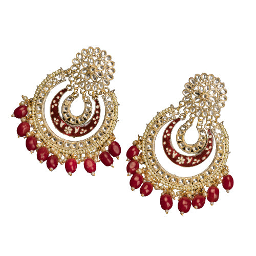 1. "Red kundan dangler earrings in gold add a vibrant touch to your festive look. Perfect for celebrations."