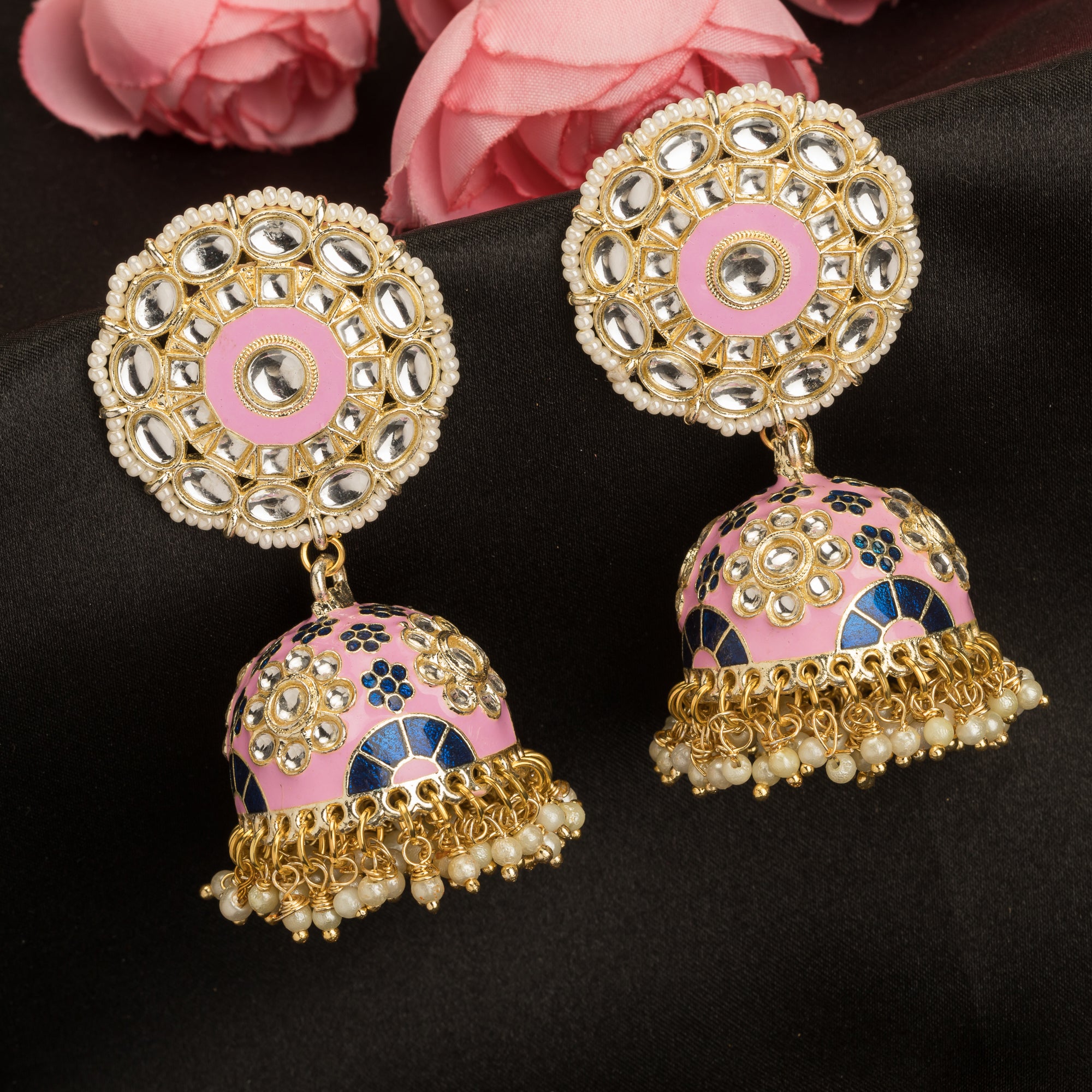 "Orchid minakari jhumka earrings in gold tone showcase intricate, vibrant designs with timeless elegance for festivals."