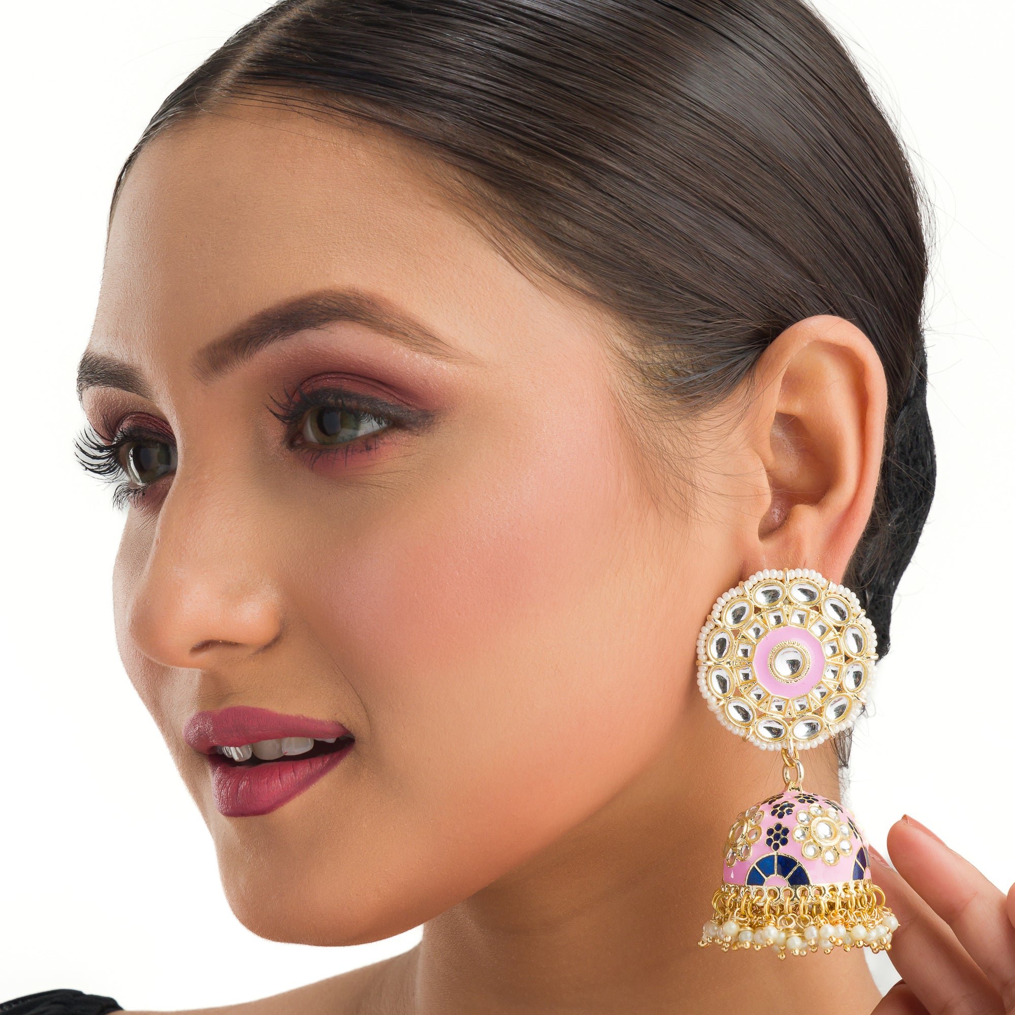 "Orchid minakari jhumka earrings in gold tone showcase intricate, vibrant designs with timeless elegance for festivals."