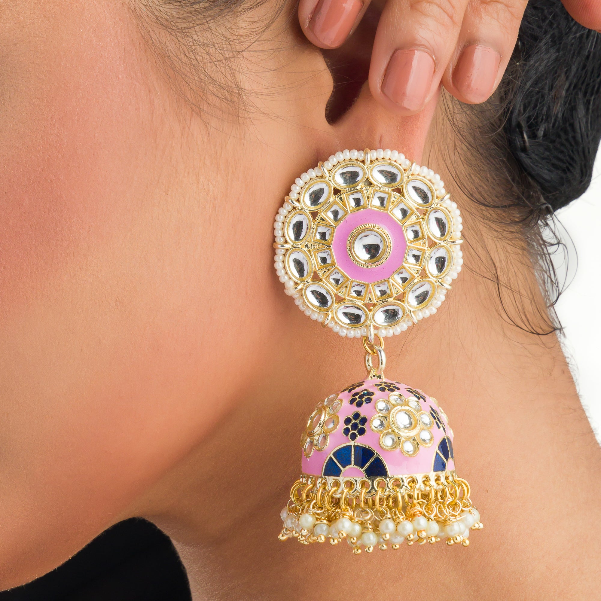 "Orchid minakari jhumka earrings in gold tone showcase intricate, vibrant designs with timeless elegance for festivals."