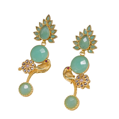 "Gold-tone dangler earrings with light green accents blend warmth and freshness for a chic, eye-catching festival look."