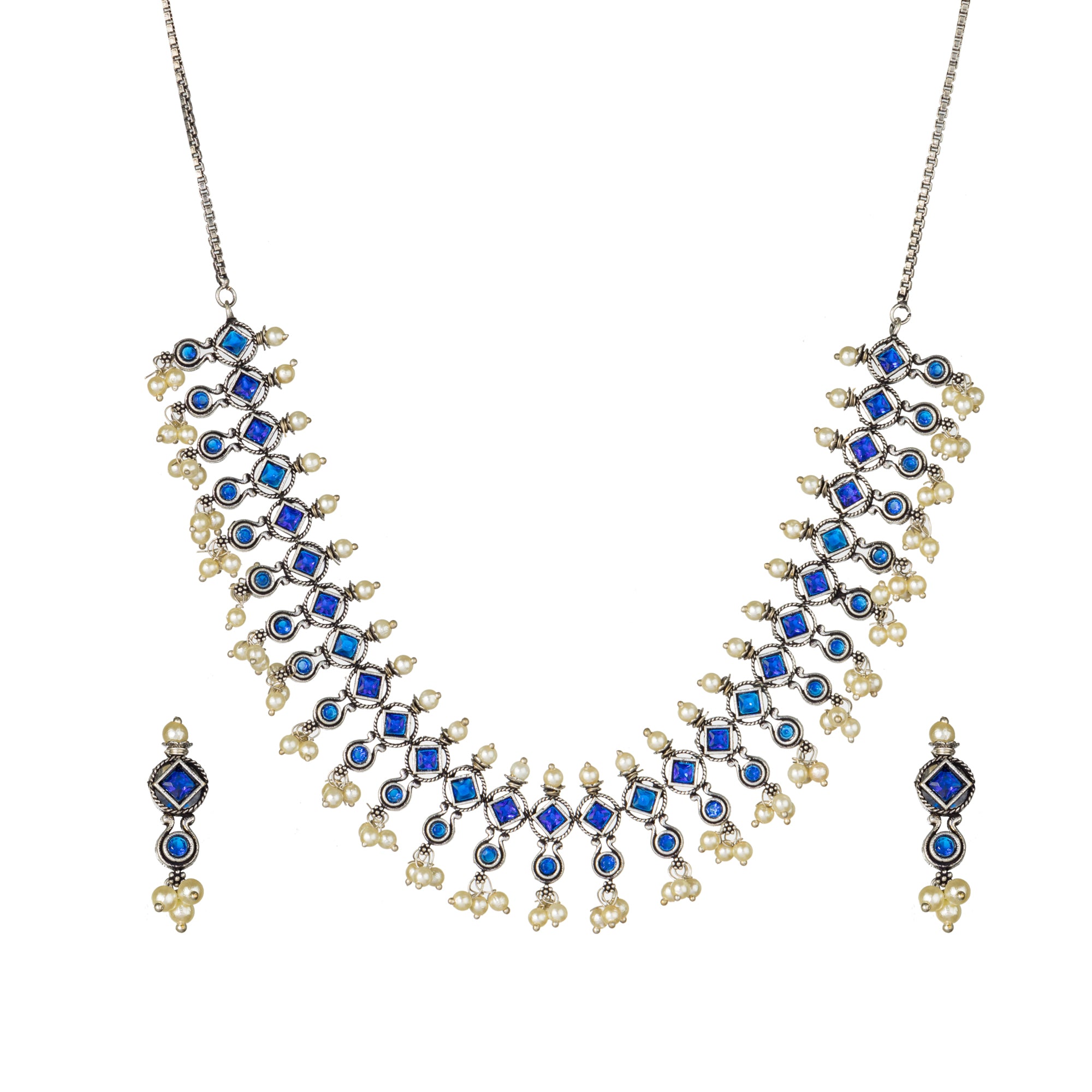 "Zircon stud earrings in silver offer intricate detailing and radiant sparkle for a traditional, elegant party wear look."