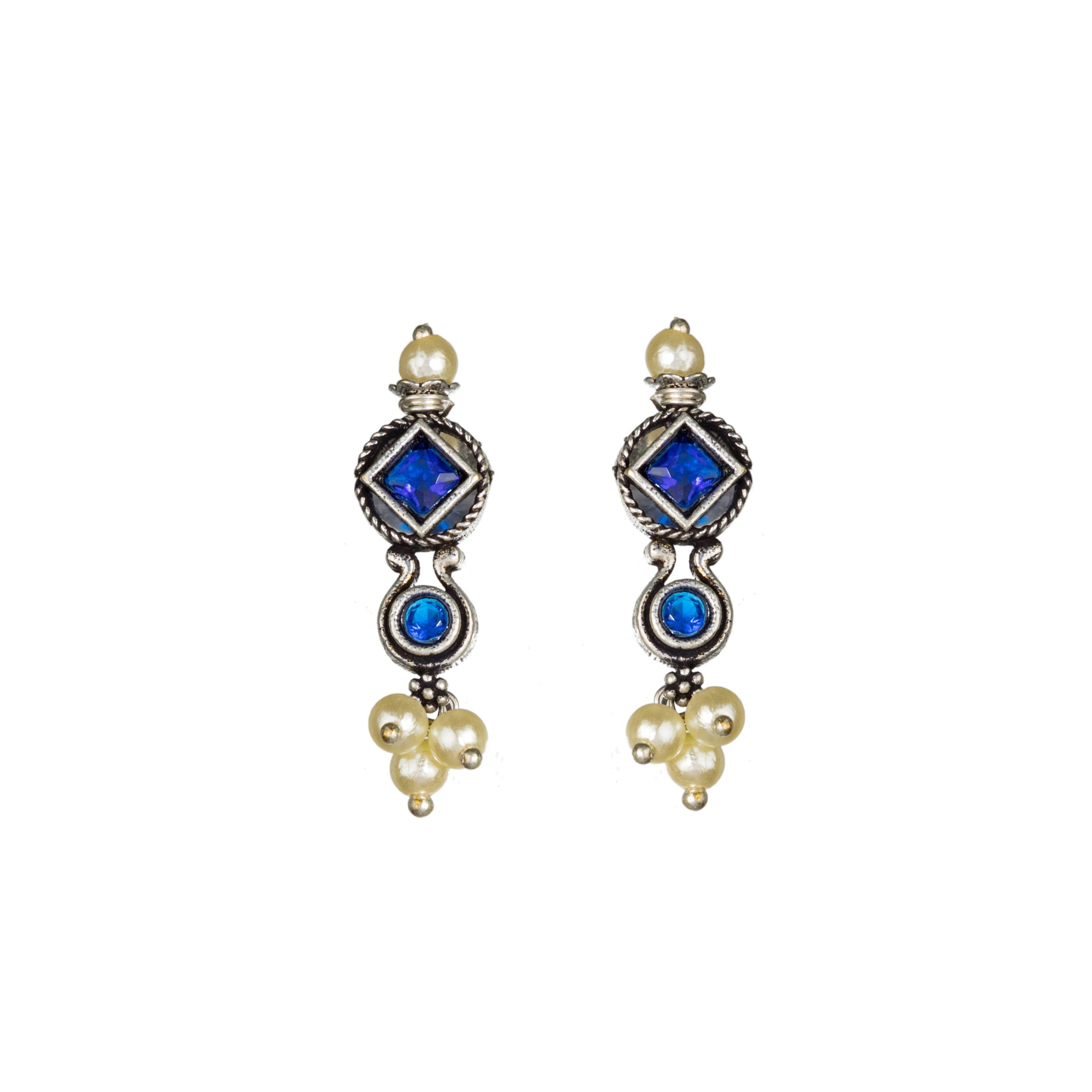 "Zircon stud earrings in silver offer intricate detailing and radiant sparkle for a traditional, elegant party wear look."