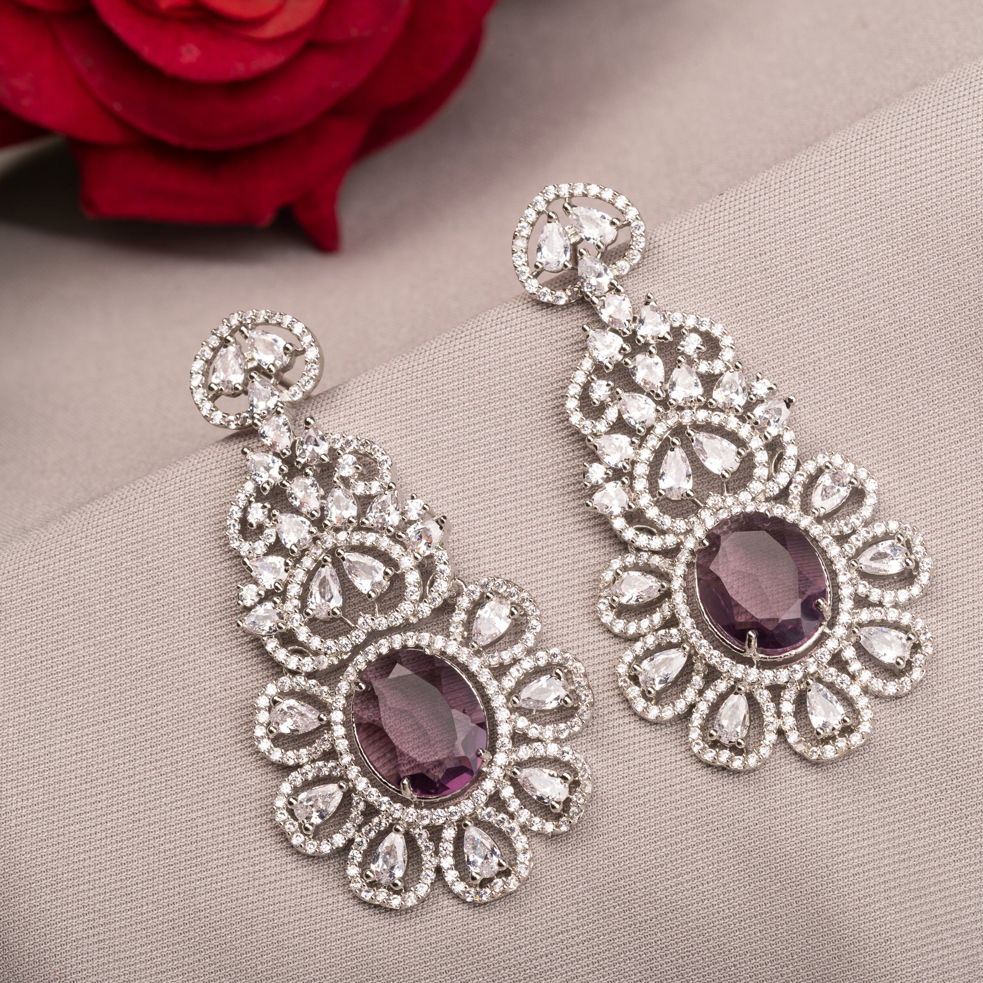 1. "Trendy purple zircon long earrings combine modern chic with sparkling elegance."