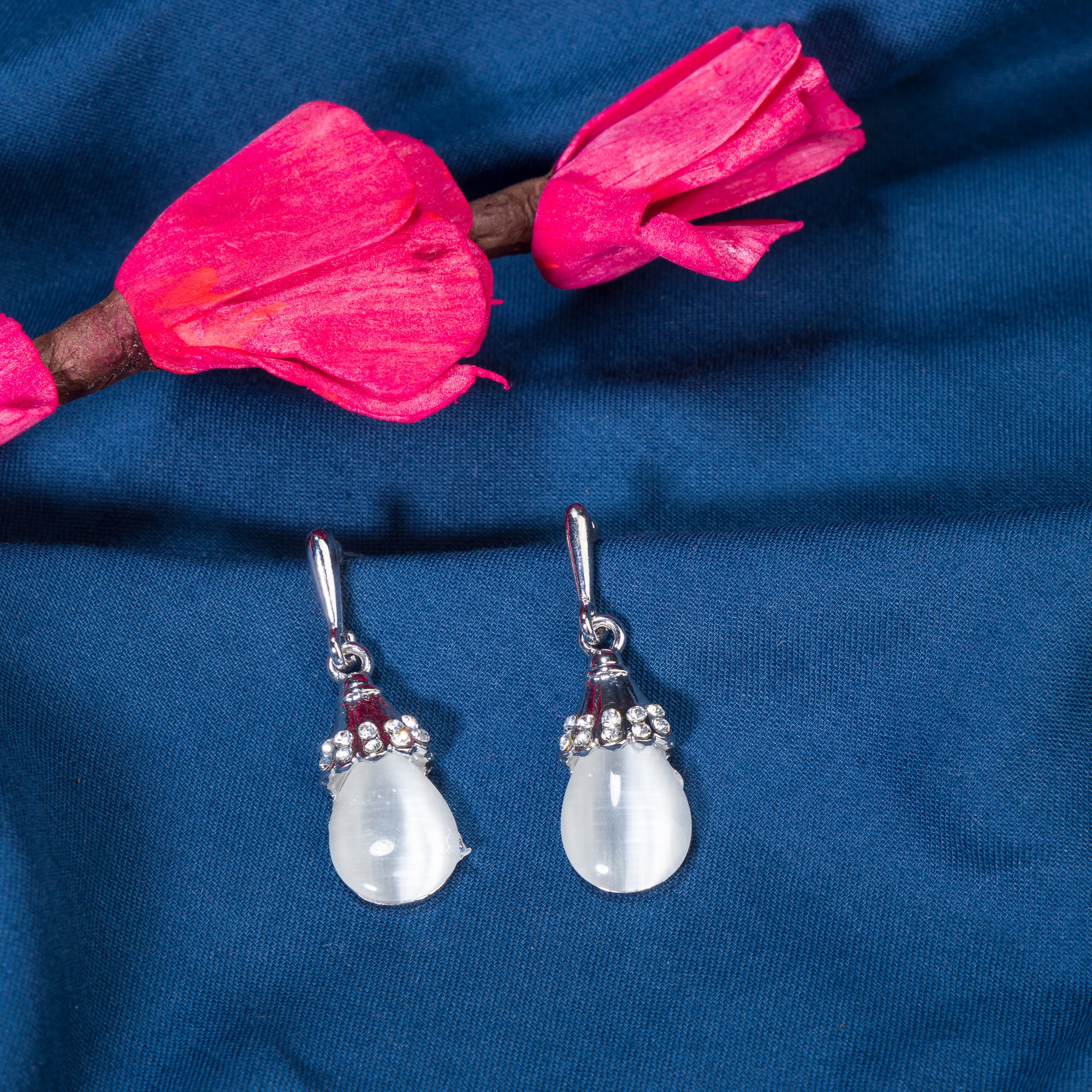 "Azure zircon hoop earring adds a bold splash of vibrant, captivating color for a chic look."