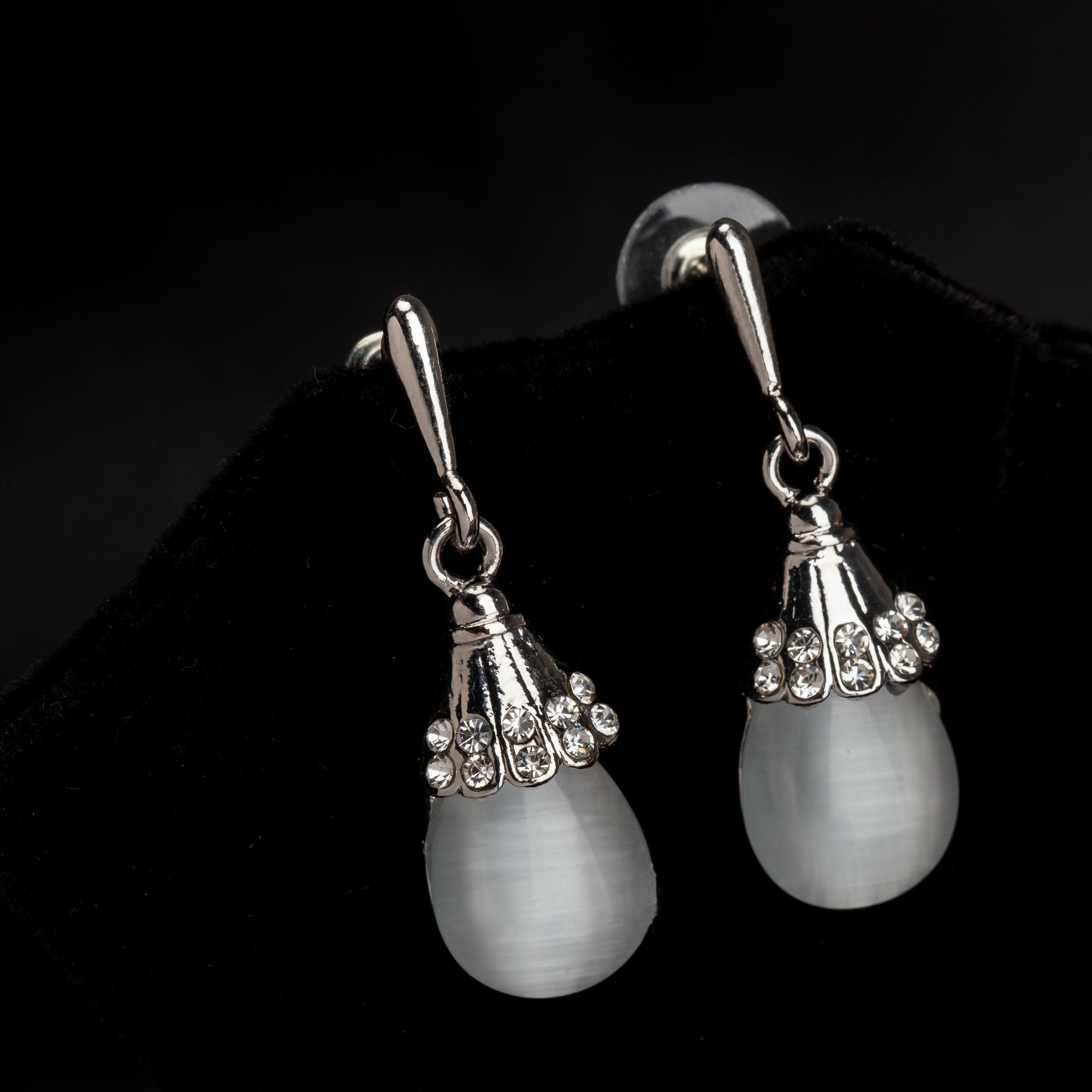 "Azure zircon hoop earring adds a bold splash of vibrant, captivating color for a chic look."