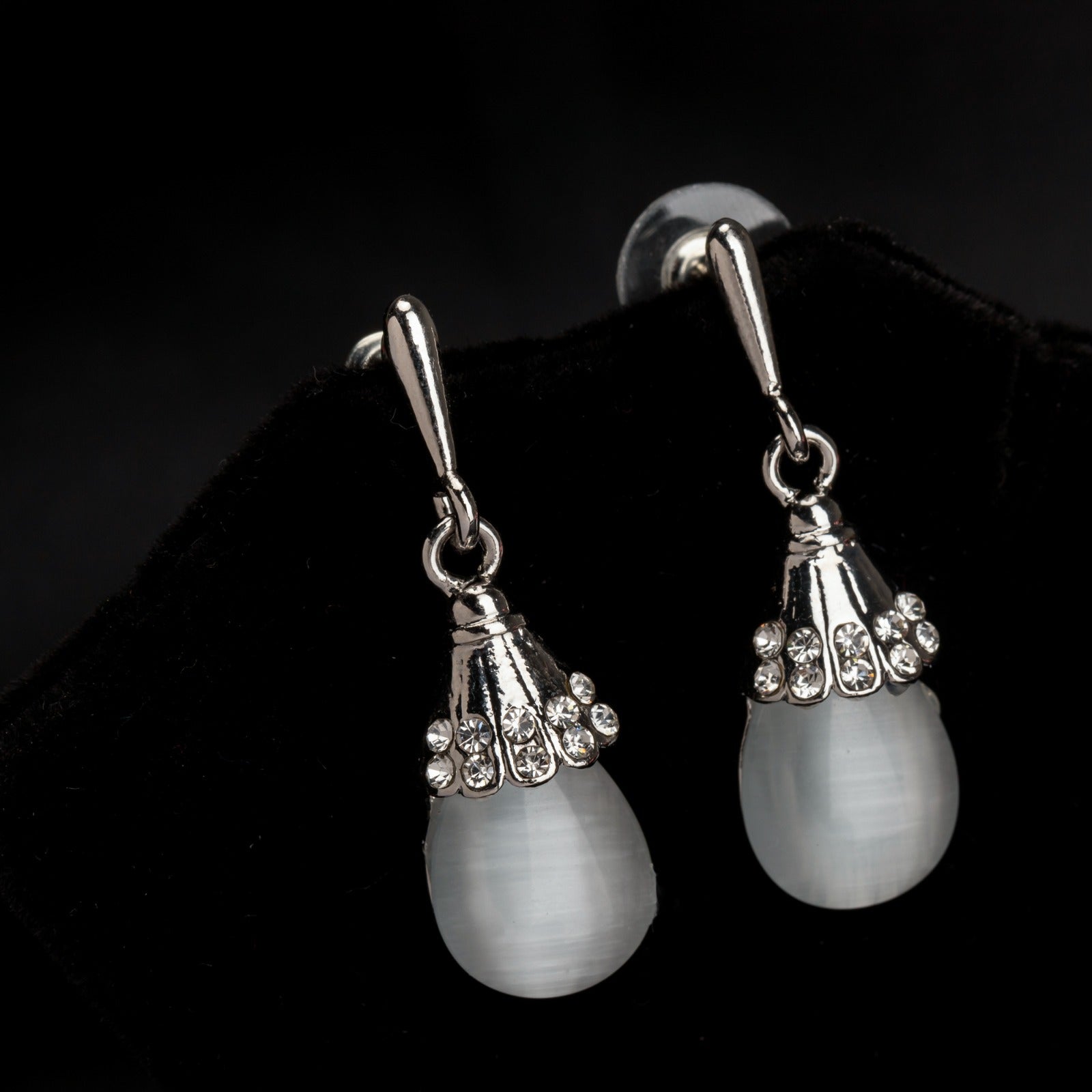 "Azure zircon hoop earring adds a bold splash of vibrant, captivating color for a chic look."