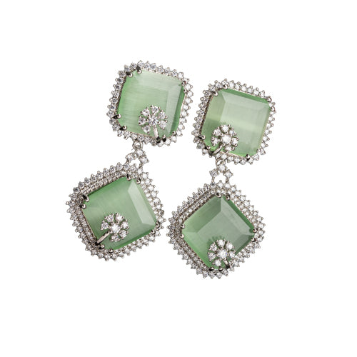 1. "Light green zircon dangler earrings offer delicate sparkle and serene elegance for any occasion."