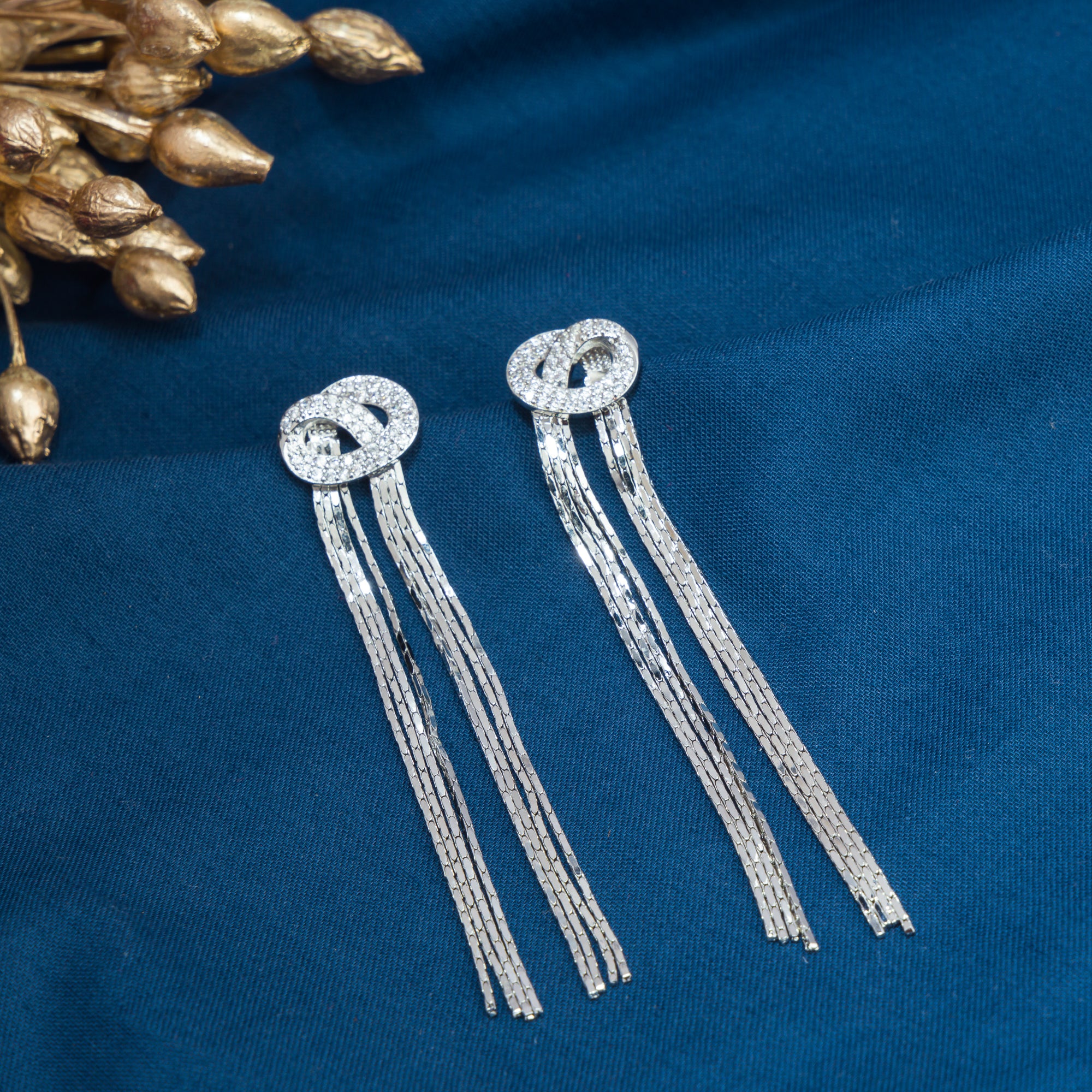 "Trendy zircon and stainless steel long earrings combine modern chic with sparkling elegance."