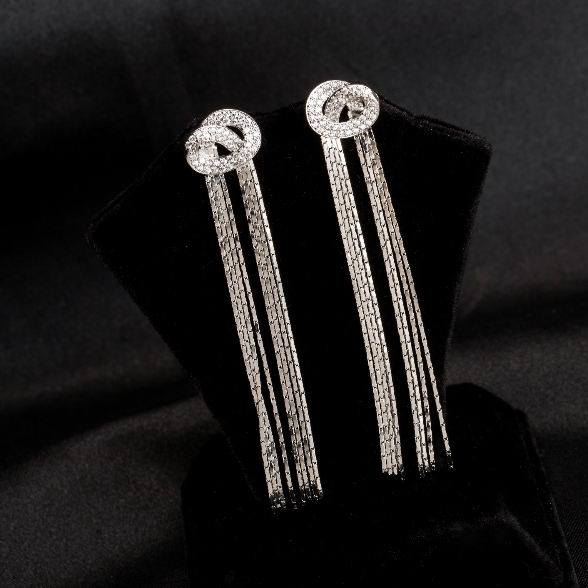 "Trendy zircon and stainless steel long earrings combine modern chic with sparkling elegance."